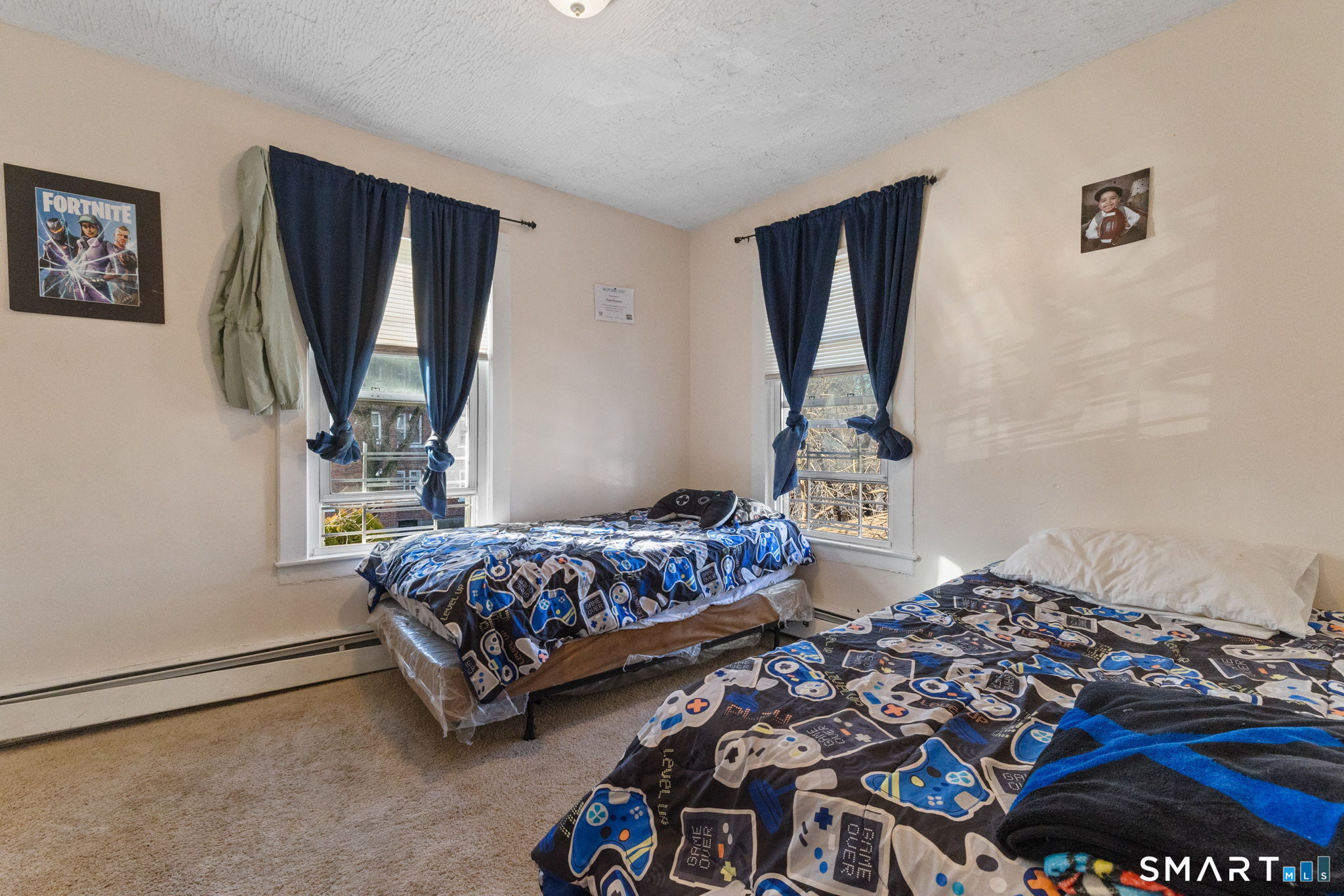 147 Martin Street Hartford, CT 06120 - Photo 25 of 34 a bedroom with bed and a window