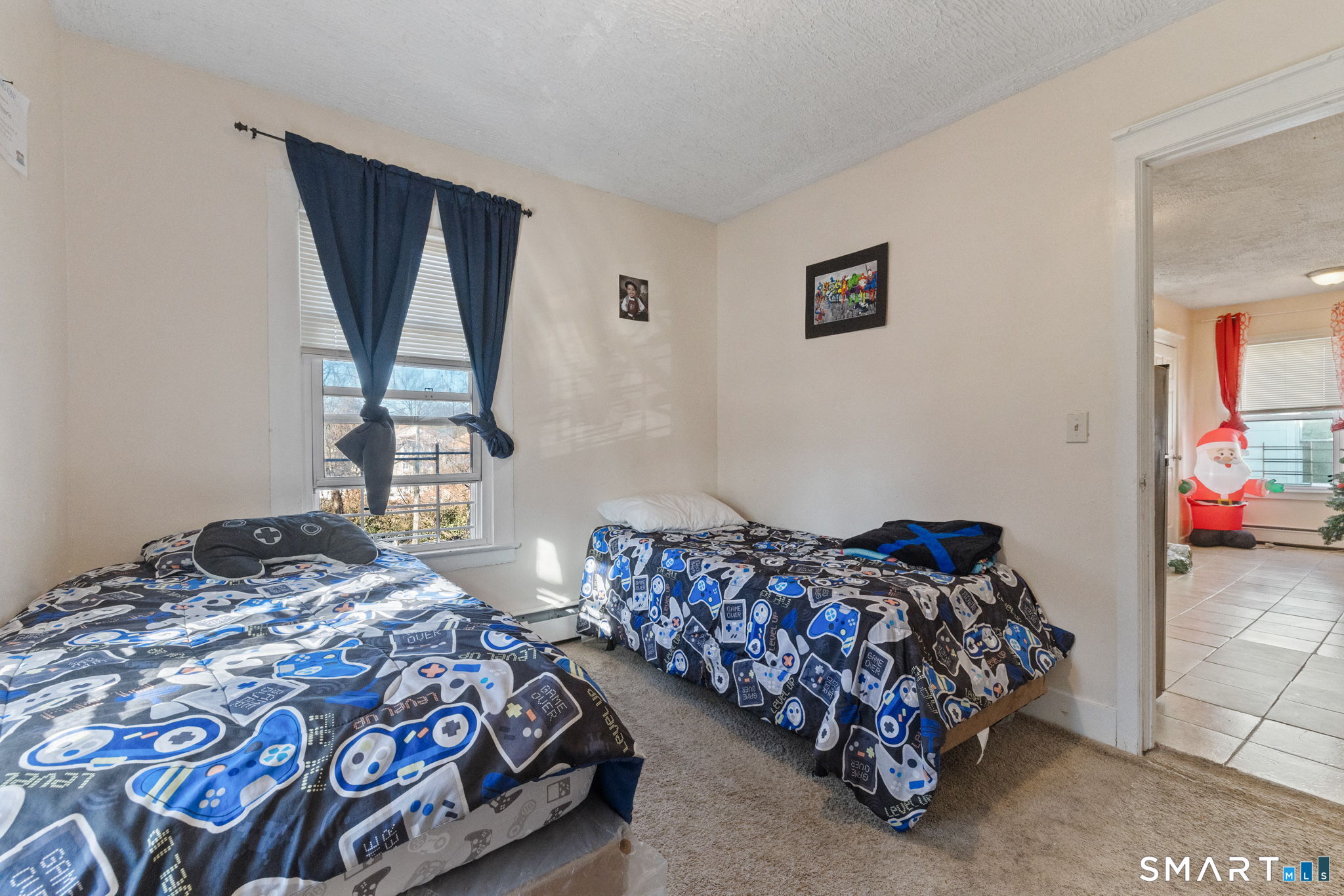 147 Martin Street Hartford, CT 06120 - Photo 26 of 34 a bedroom with a bed and a window