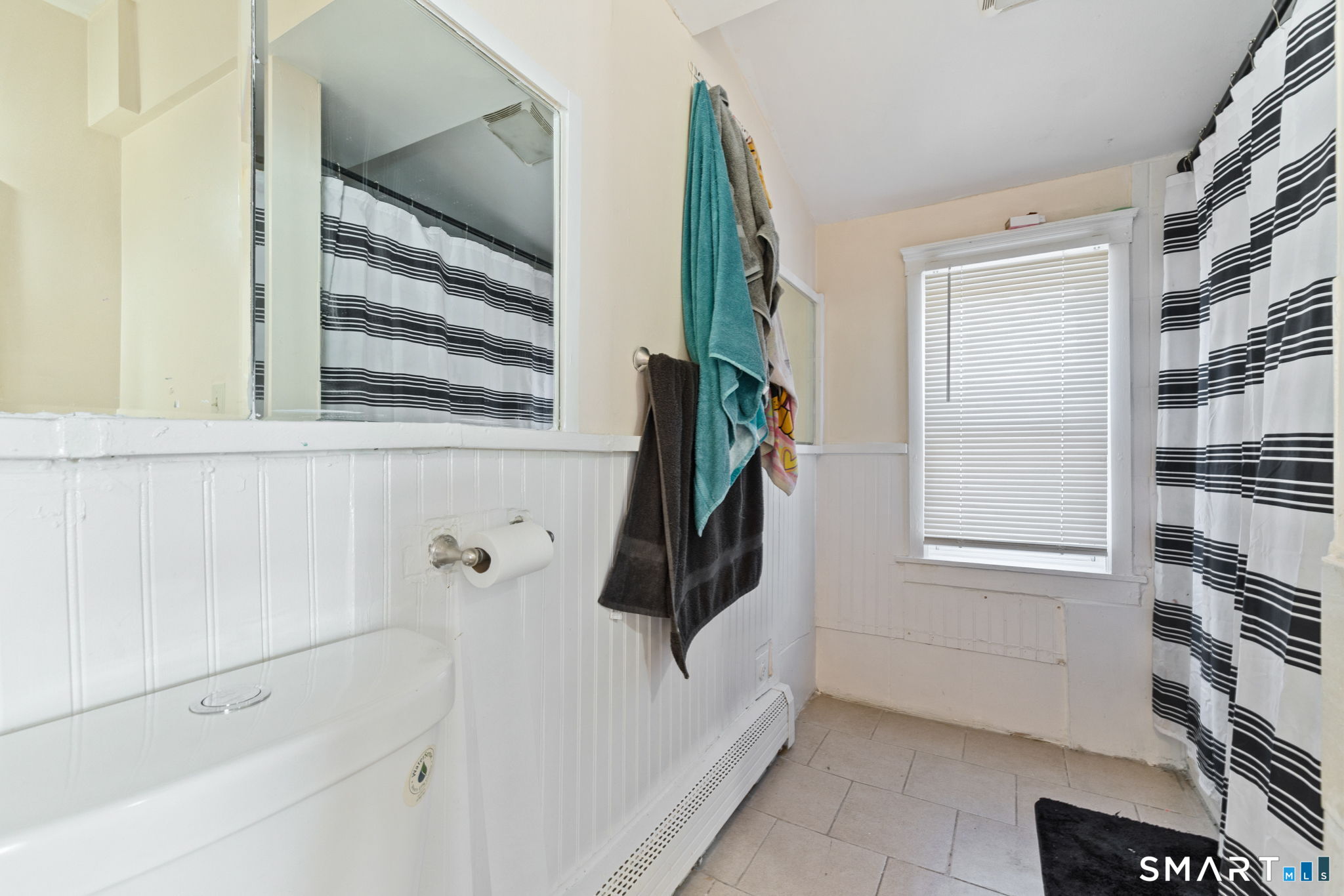 147 Martin Street Hartford, CT 06120 - Photo 27 of 34 a bathroom with a bathtub and a window