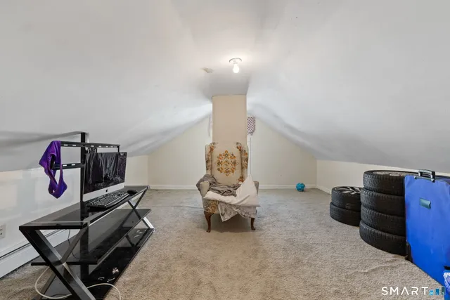 a bedroom with bed and cabinets