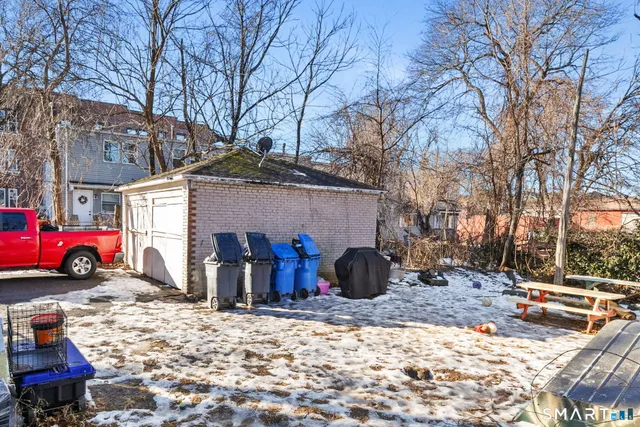 a view of a car park in front of a house