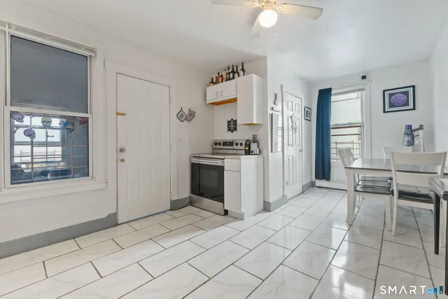 a view of kitchen with furniture and window