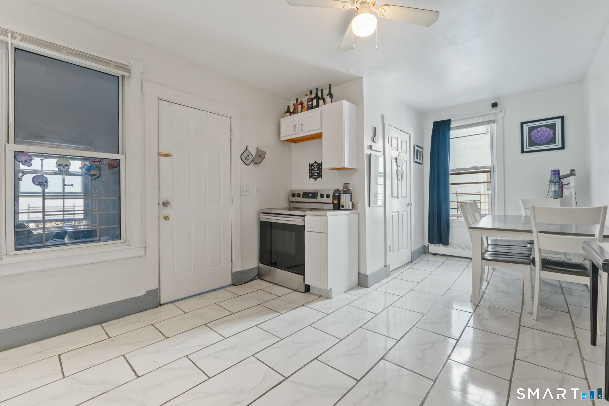 147 Martin Street Hartford, CT 06120 - Photo 5 of 34 a view of kitchen with furniture and window