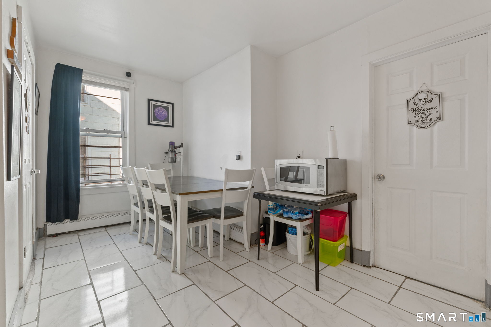 147 Martin Street Hartford, CT 06120 - Photo 8 of 34 a dining room with furniture and a window