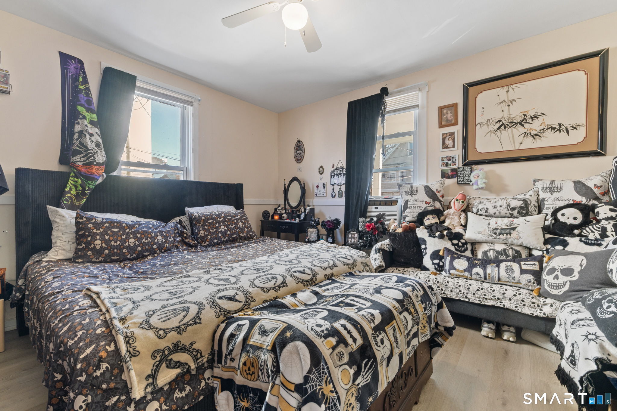 147 Martin Street Hartford, CT 06120 - Photo 10 of 34 a bedroom with a large bed and three windows