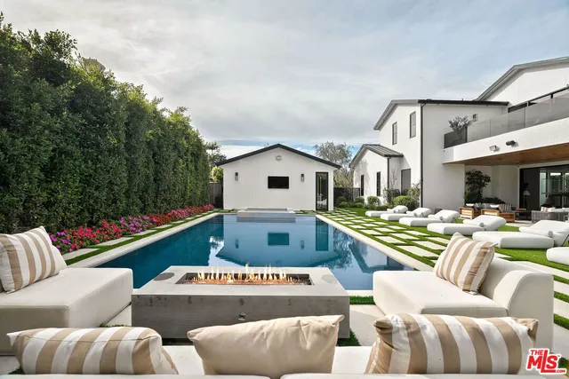 a kitchen with a table and chairs in it
