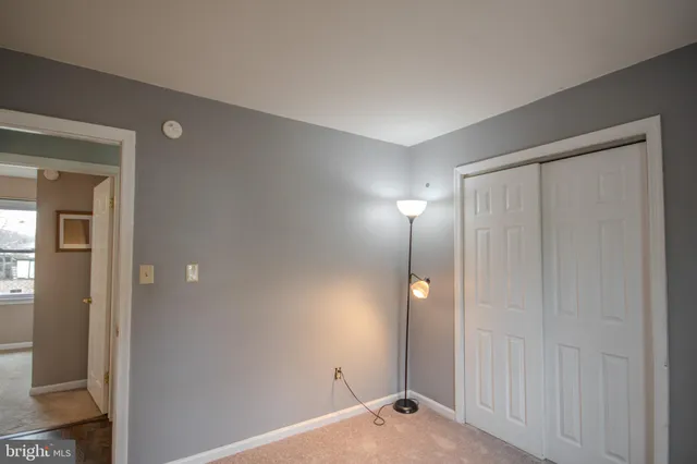 an outdoor space with patio and white umbrellas