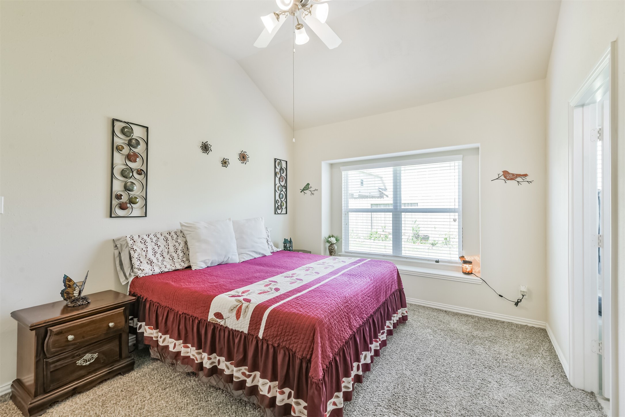 7527 Windsor Valley Lane Houston, TX 77049 - Photo 23 of 35 a bedroom with a bed a dresser and a window