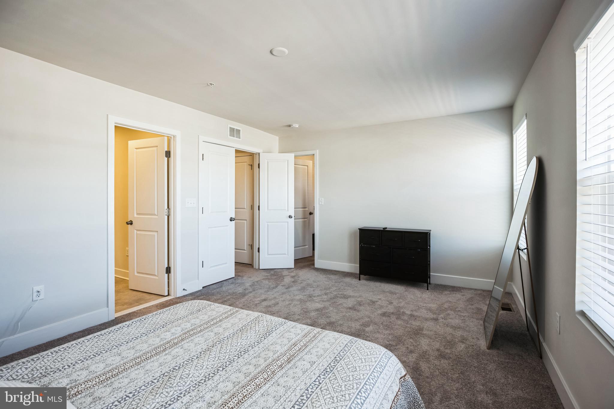 4165 Brodie Place White Plains, MD 20695 - Photo 11 of 28 a bedroom with a bed and a dresser