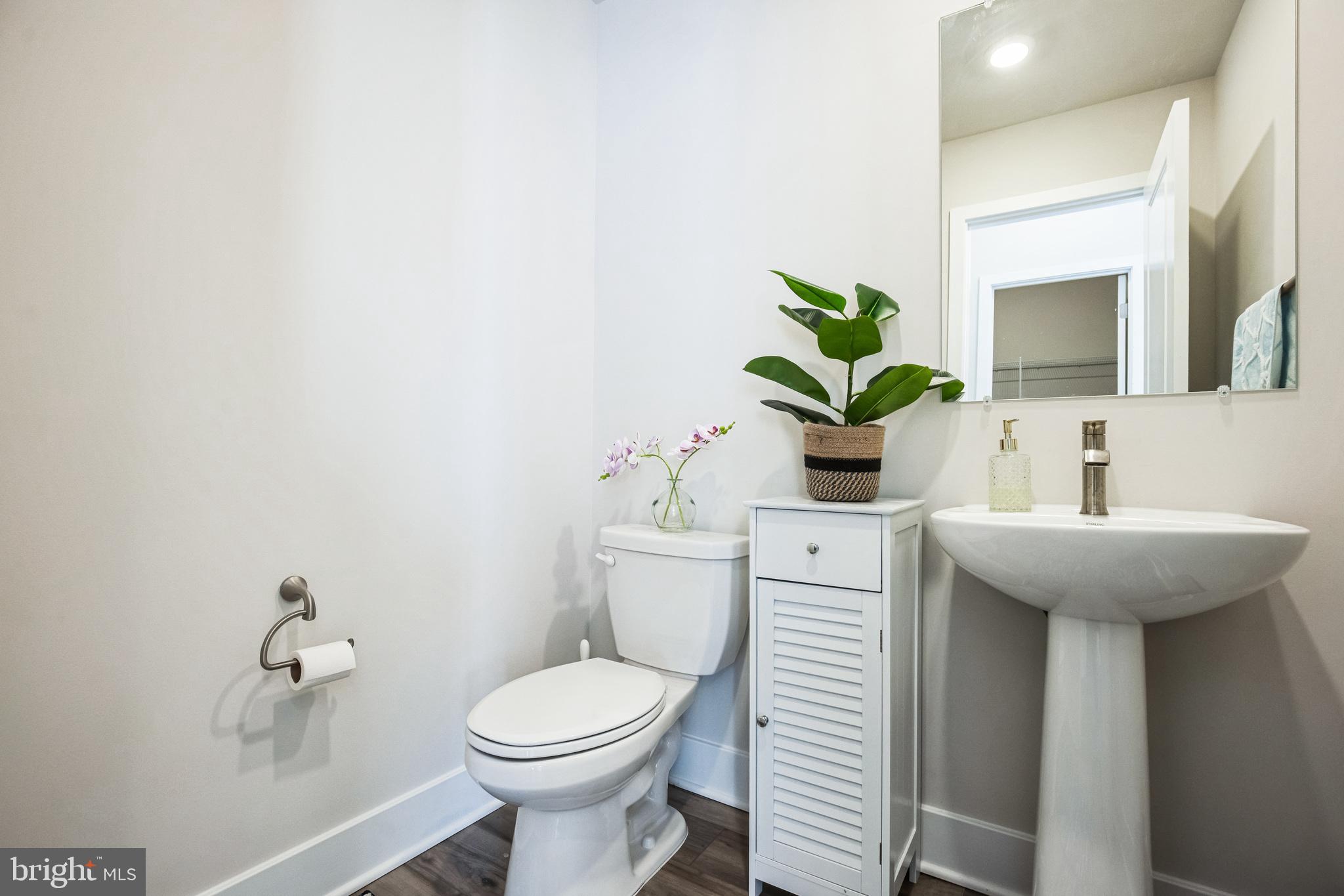 4165 Brodie Place White Plains, MD 20695 - Photo 15 of 28 a bathroom with a sink toilet and a mirror