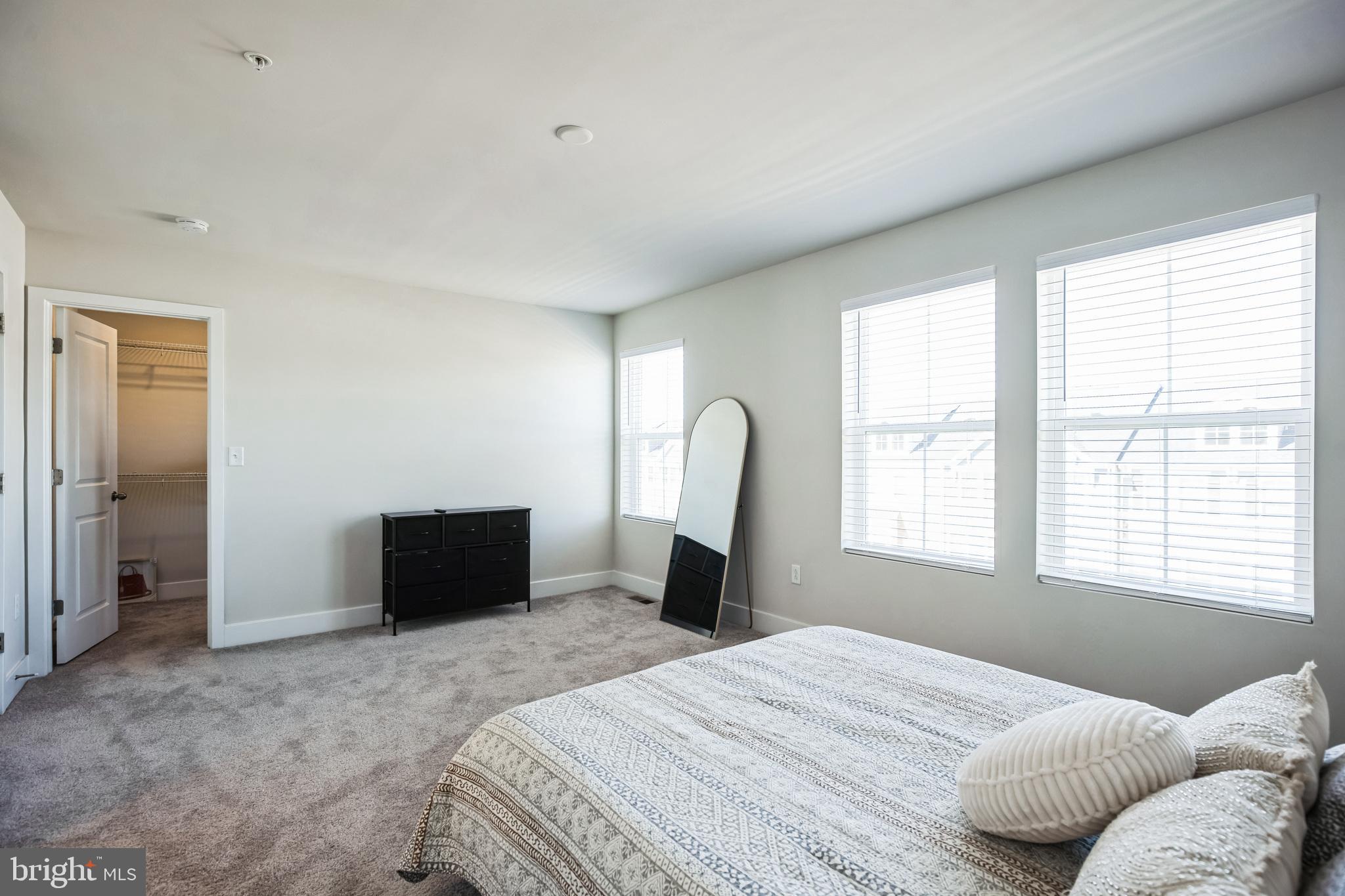 4165 Brodie Place White Plains, MD 20695 - Photo 22 of 28 a bedroom with a bed and a window