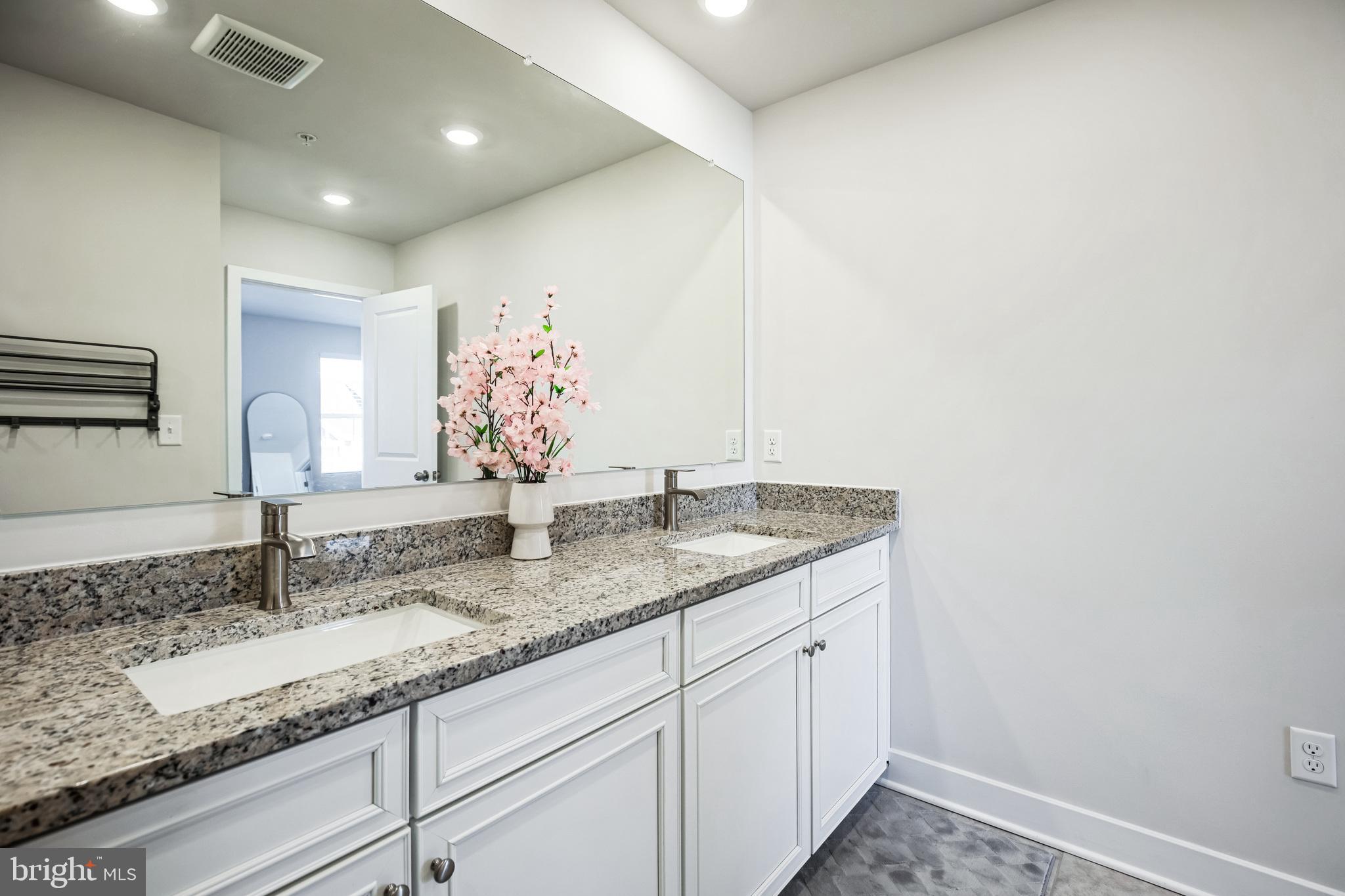 4165 Brodie Place White Plains, MD 20695 - Photo 27 of 28 a bathroom with a granite countertop sink and a mirror
