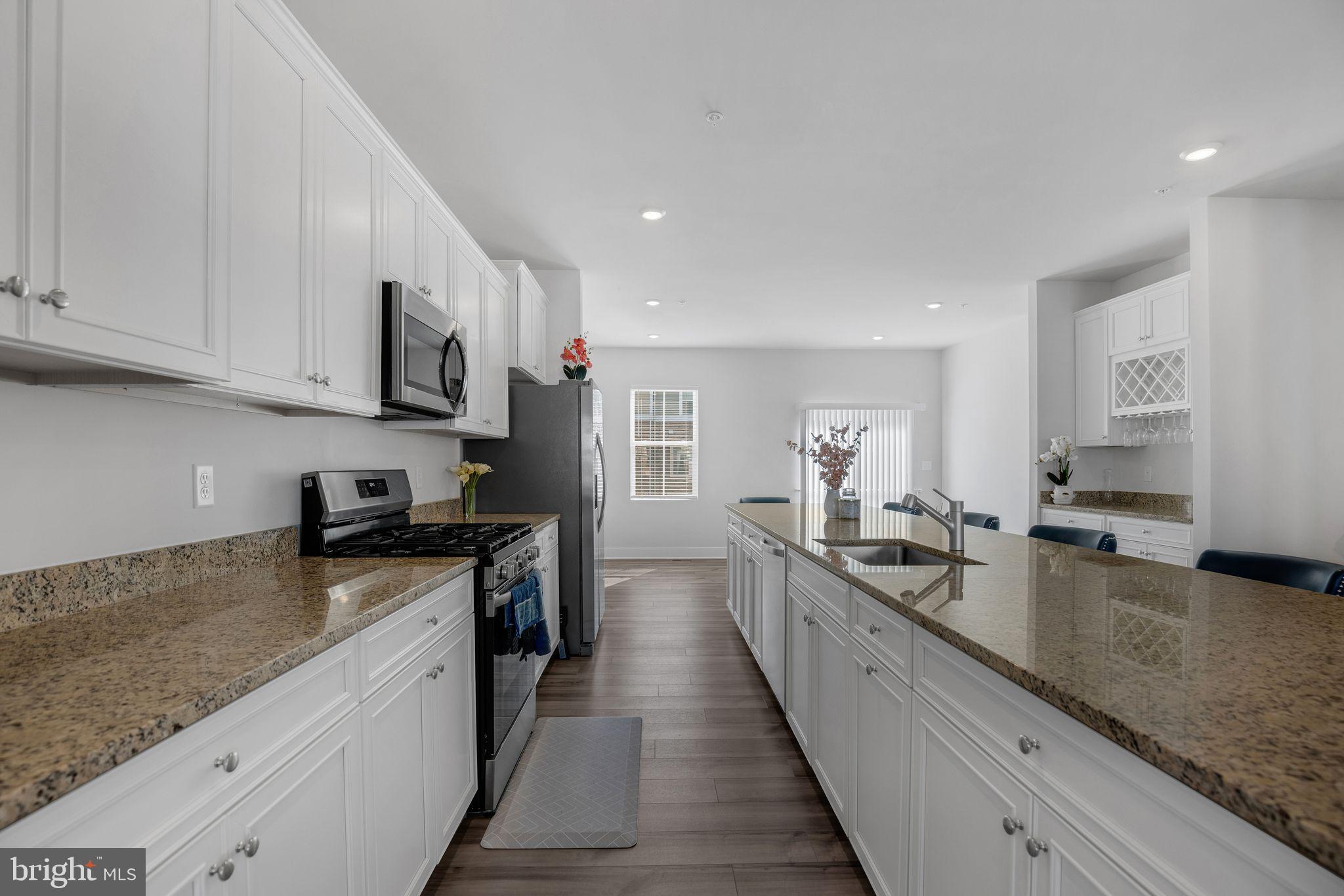 4165 Brodie Place White Plains, MD 20695 - Photo 3 of 28 a large kitchen with stainless steel appliances granite countertop a lot of counter space