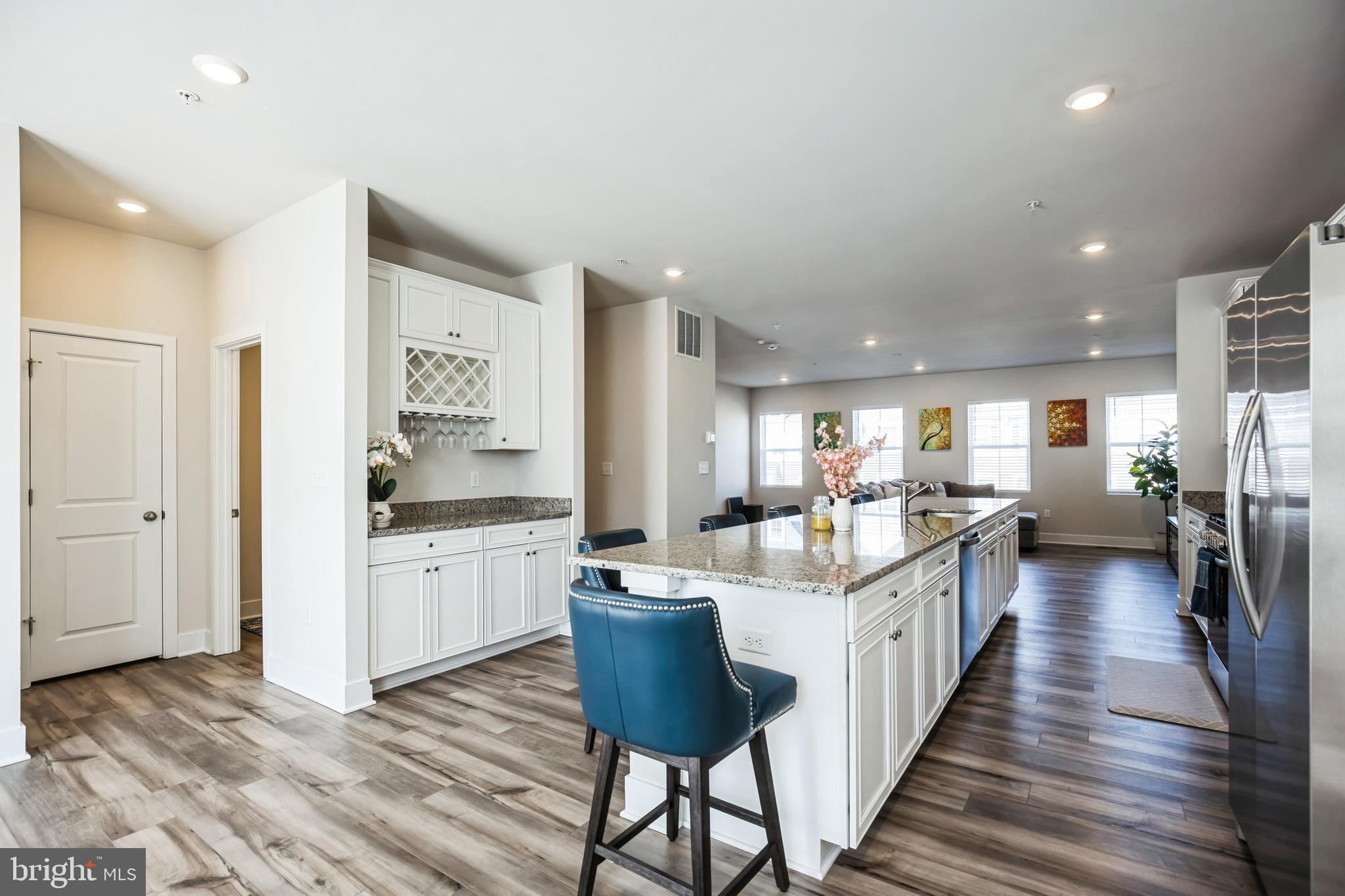 4165 Brodie Place White Plains, MD 20695 - Photo 4 of 28 a kitchen with a sink and wooden floor