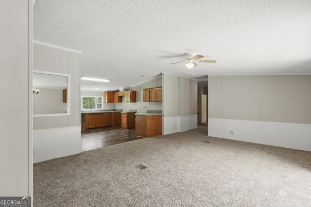 a view of a kitchen with a sink cabinet a kitchen and a window