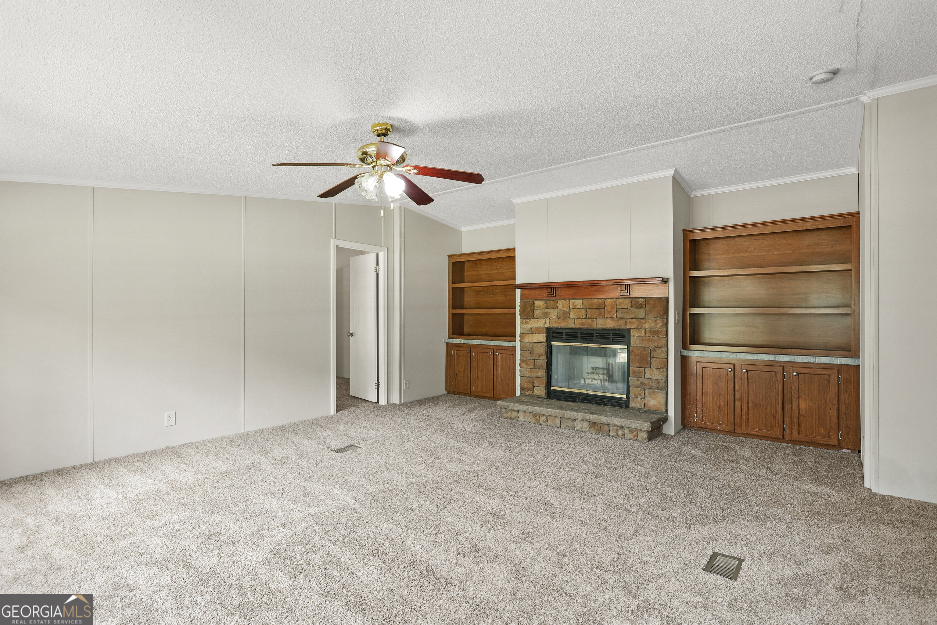 2830 Rincon-Stillwell Road Rincon, GA 31326 - Photo 21 of 52 a view of empty room with a fireplace and fan