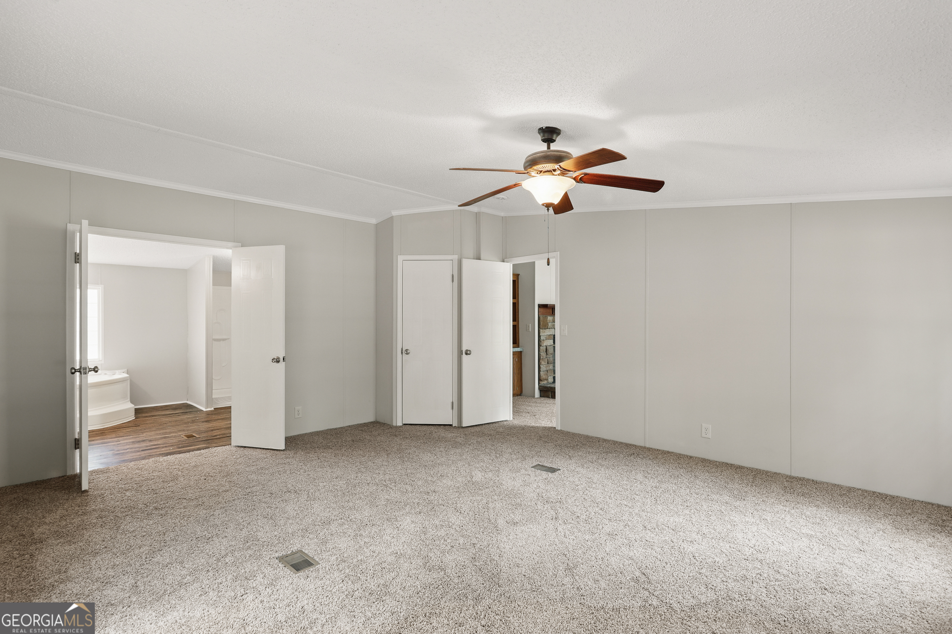 2830 Rincon-Stillwell Road Rincon, GA 31326 - Photo 24 of 52 an empty room with closet and a ceiling fan