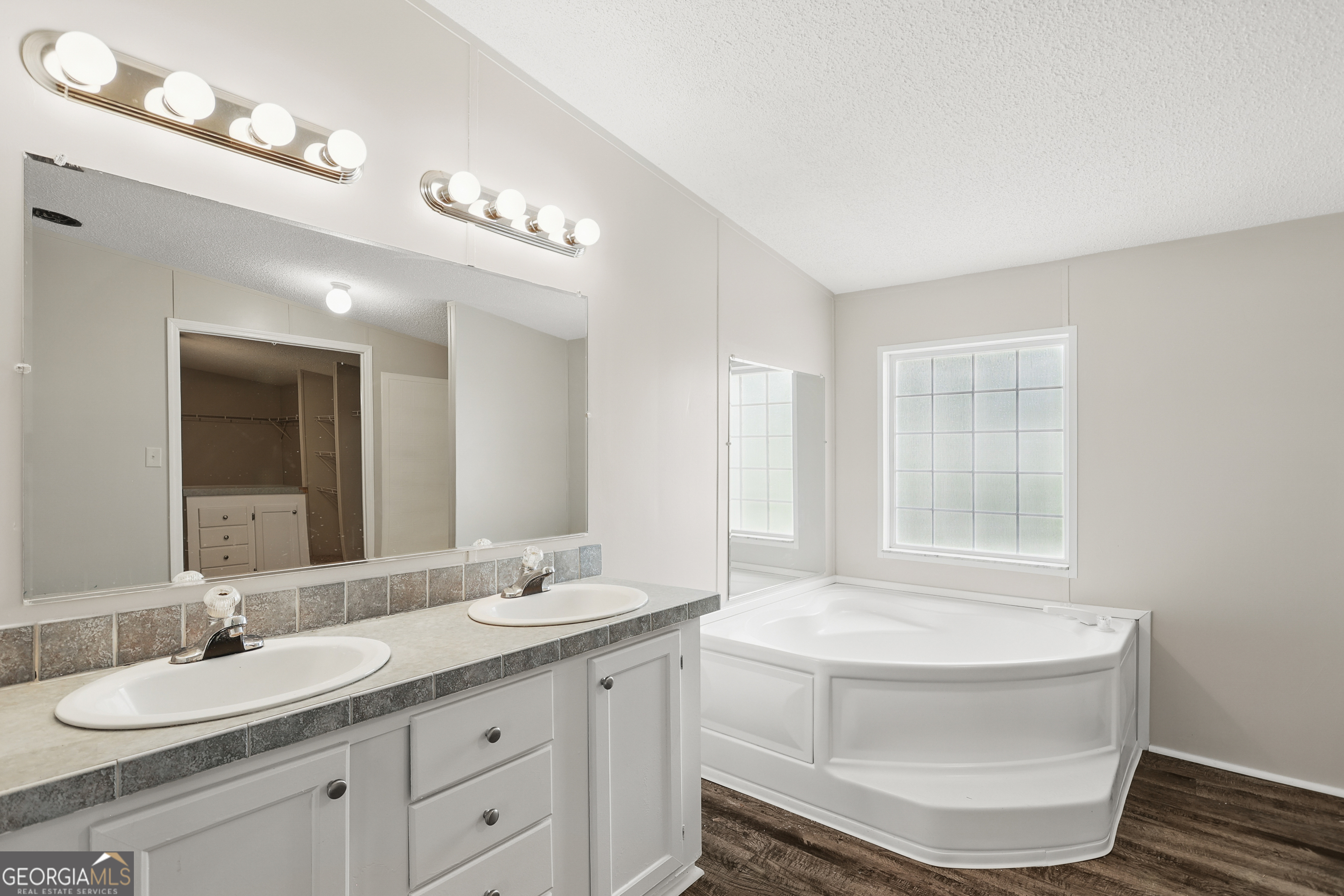 2830 Rincon-Stillwell Road Rincon, GA 31326 - Photo 28 of 52 a bathroom with a granite countertop sink and a mirror