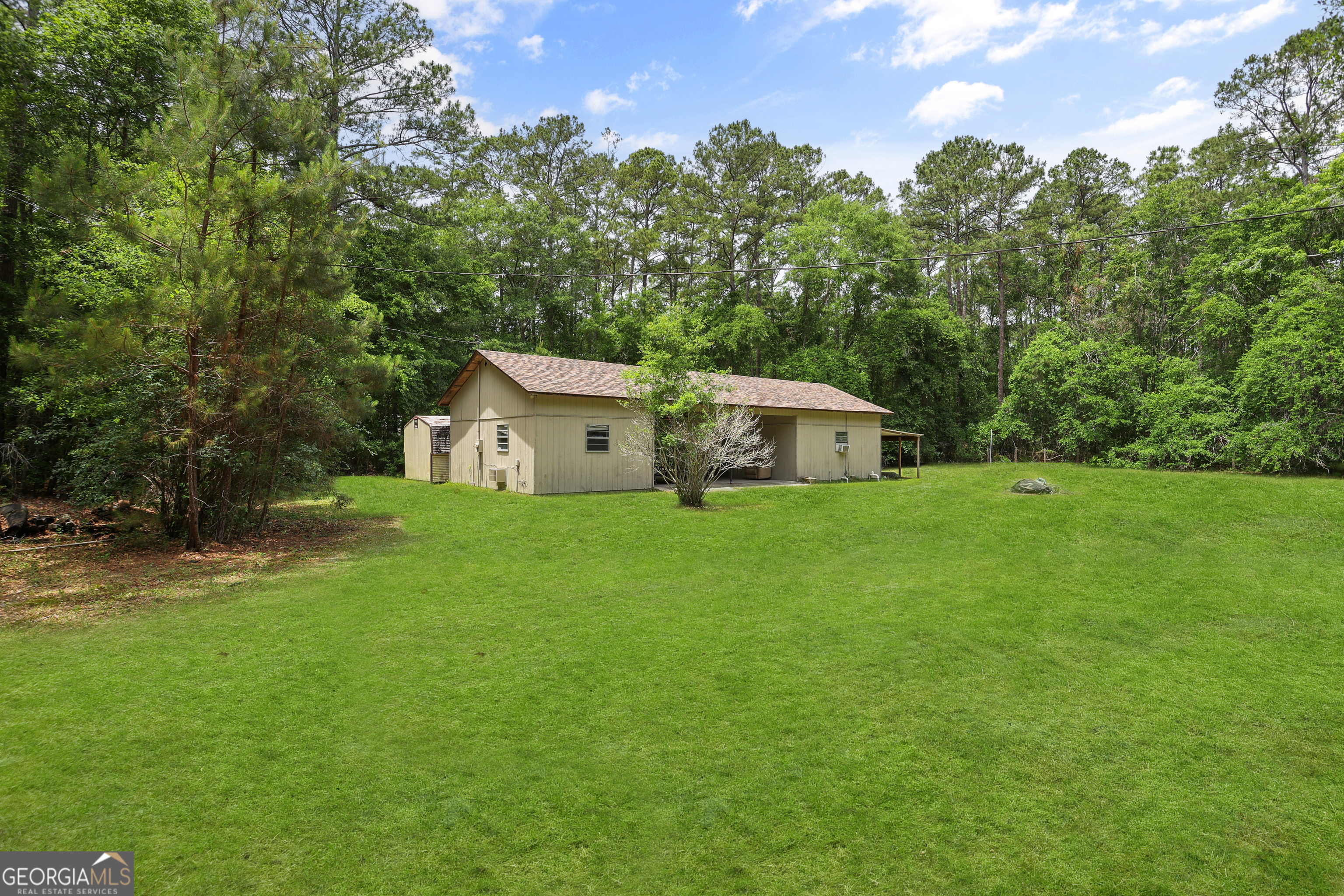 2830 Rincon-Stillwell Road Rincon, GA 31326 - Photo 3 of 52 a house view with a garden space