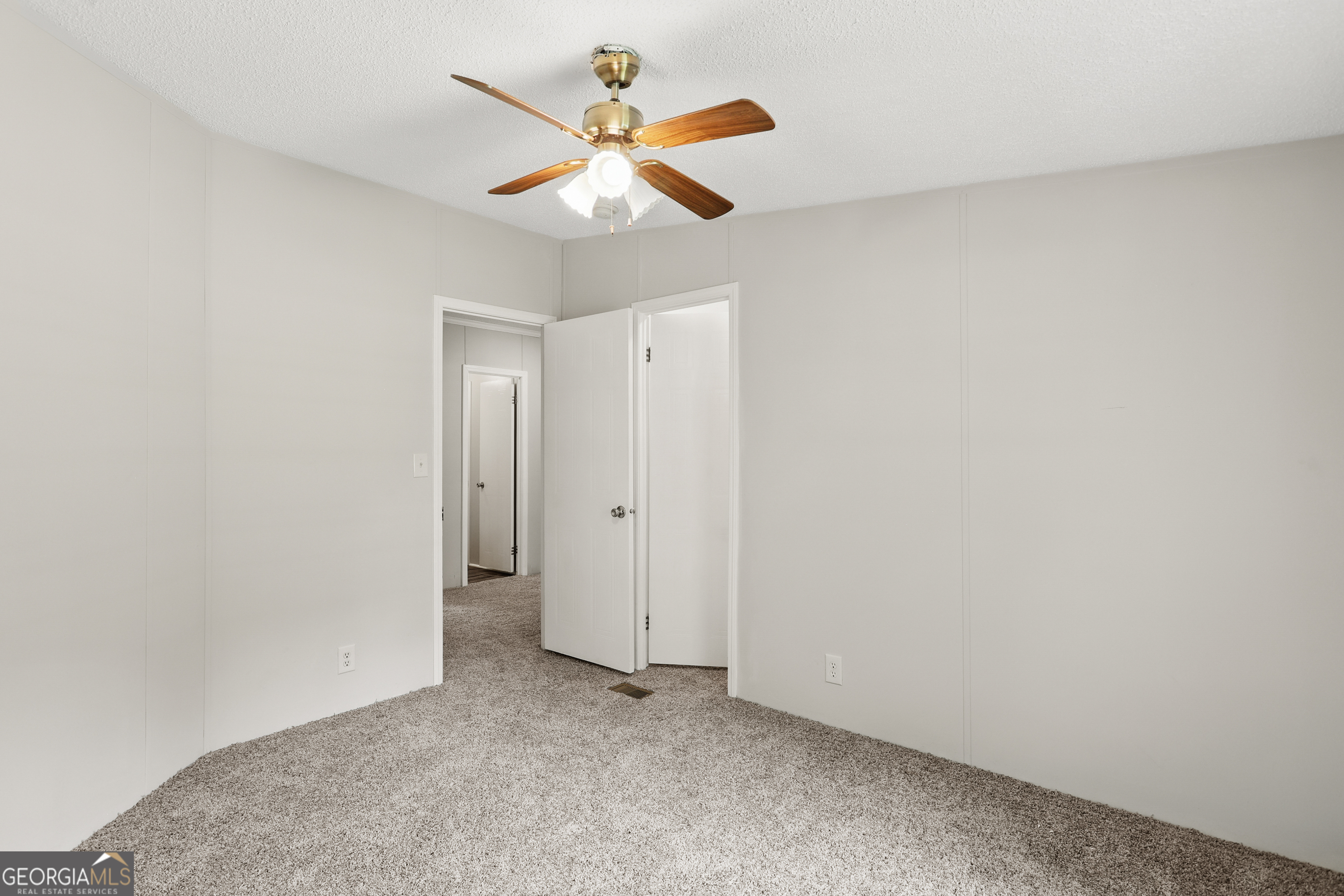2830 Rincon-Stillwell Road Rincon, GA 31326 - Photo 34 of 52 an empty room with a ceiling fan and a window