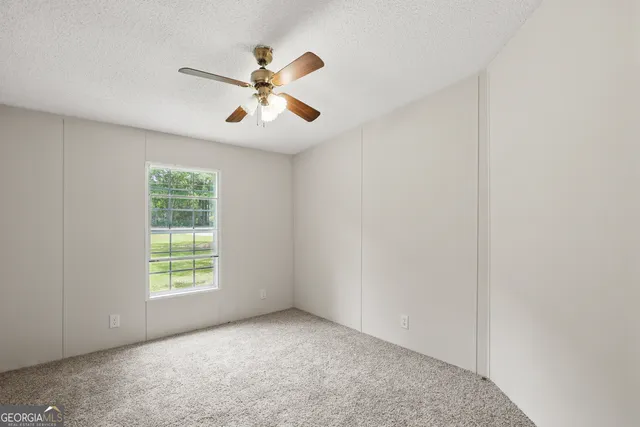 a bathroom with a toilet a sink and a mirror