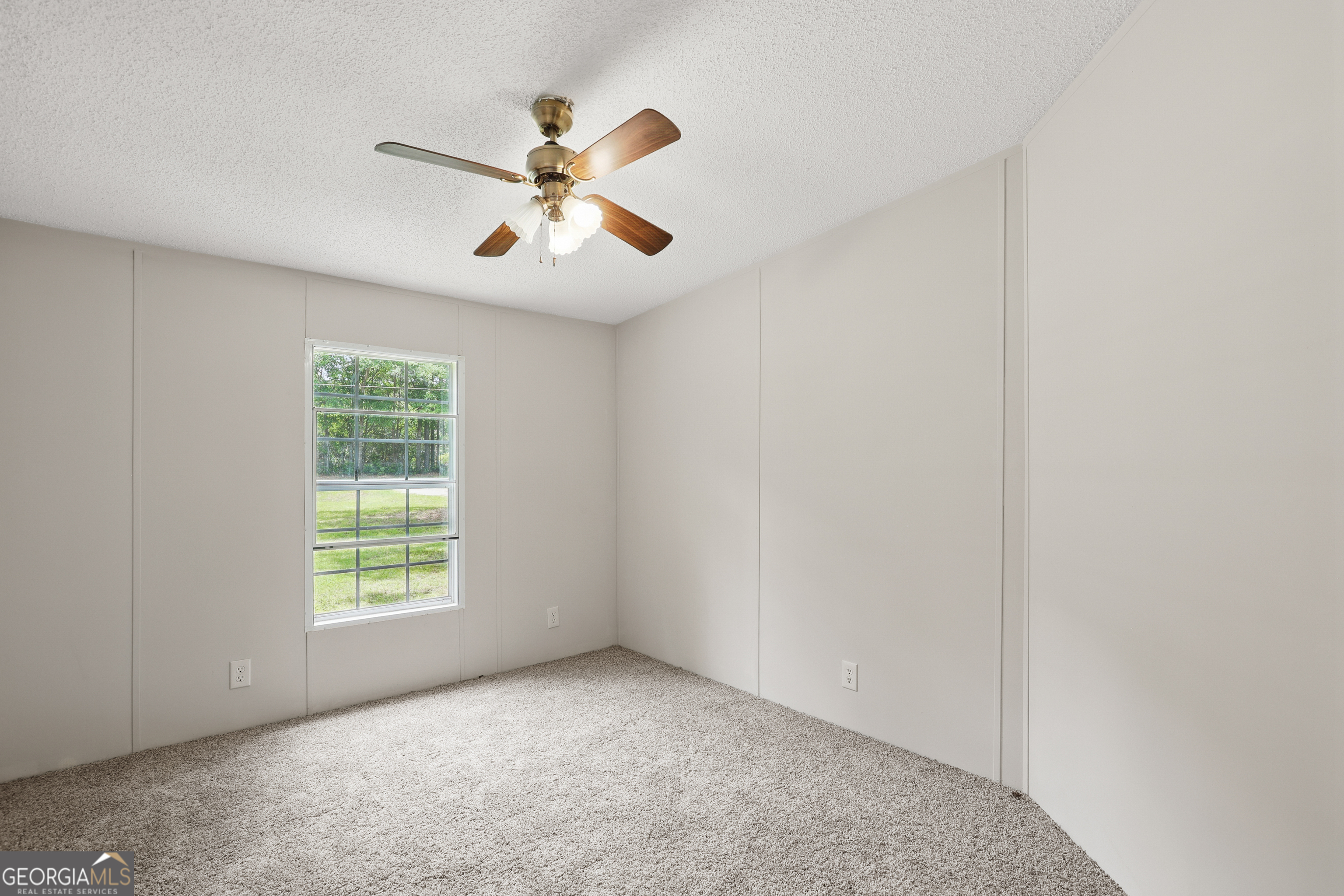 2830 Rincon-Stillwell Road Rincon, GA 31326 - Photo 38 of 52 an empty room with windows and fan
