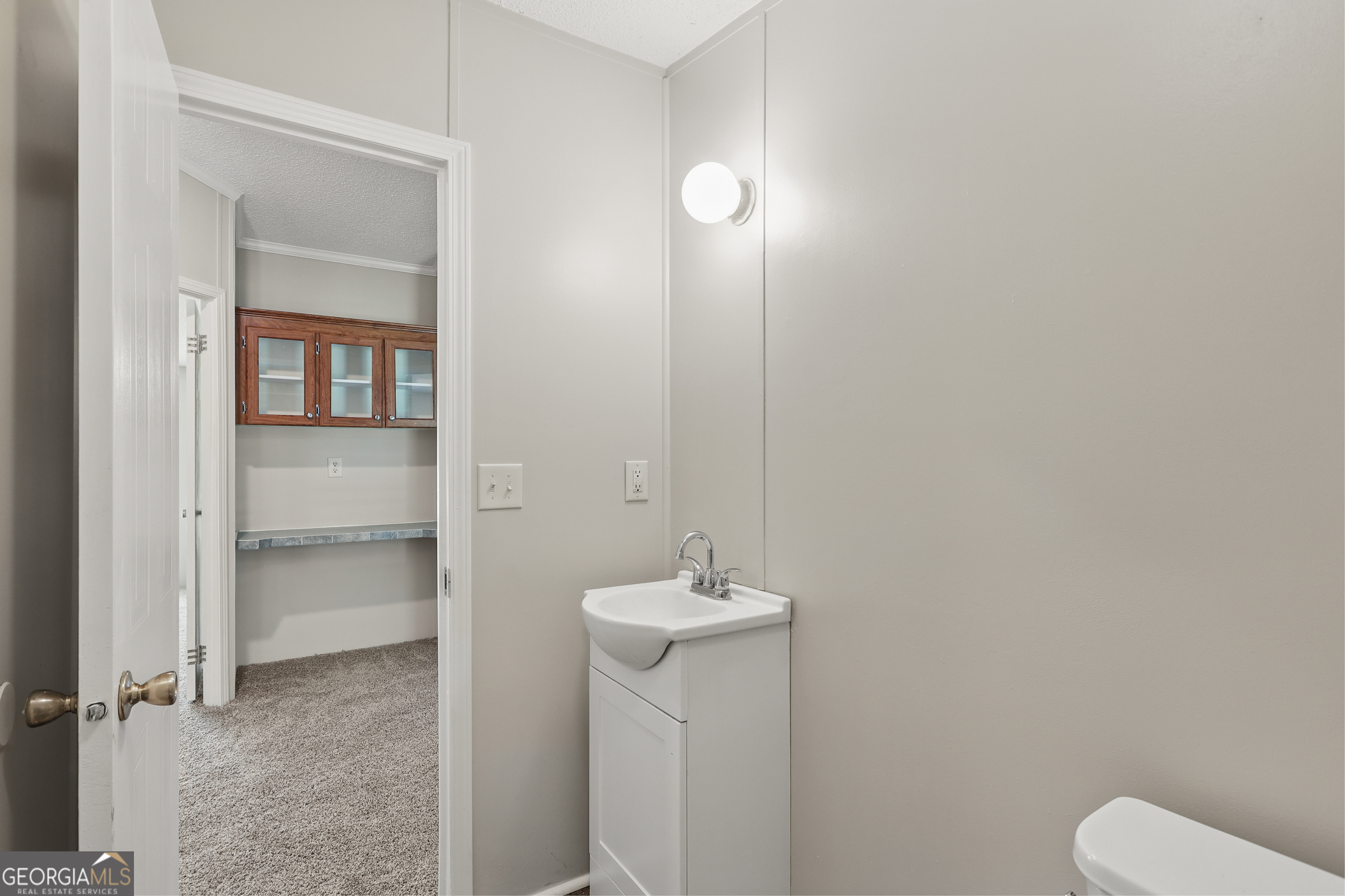 2830 Rincon-Stillwell Road Rincon, GA 31326 - Photo 41 of 52 a bathroom with a sink a toilet and a mirror