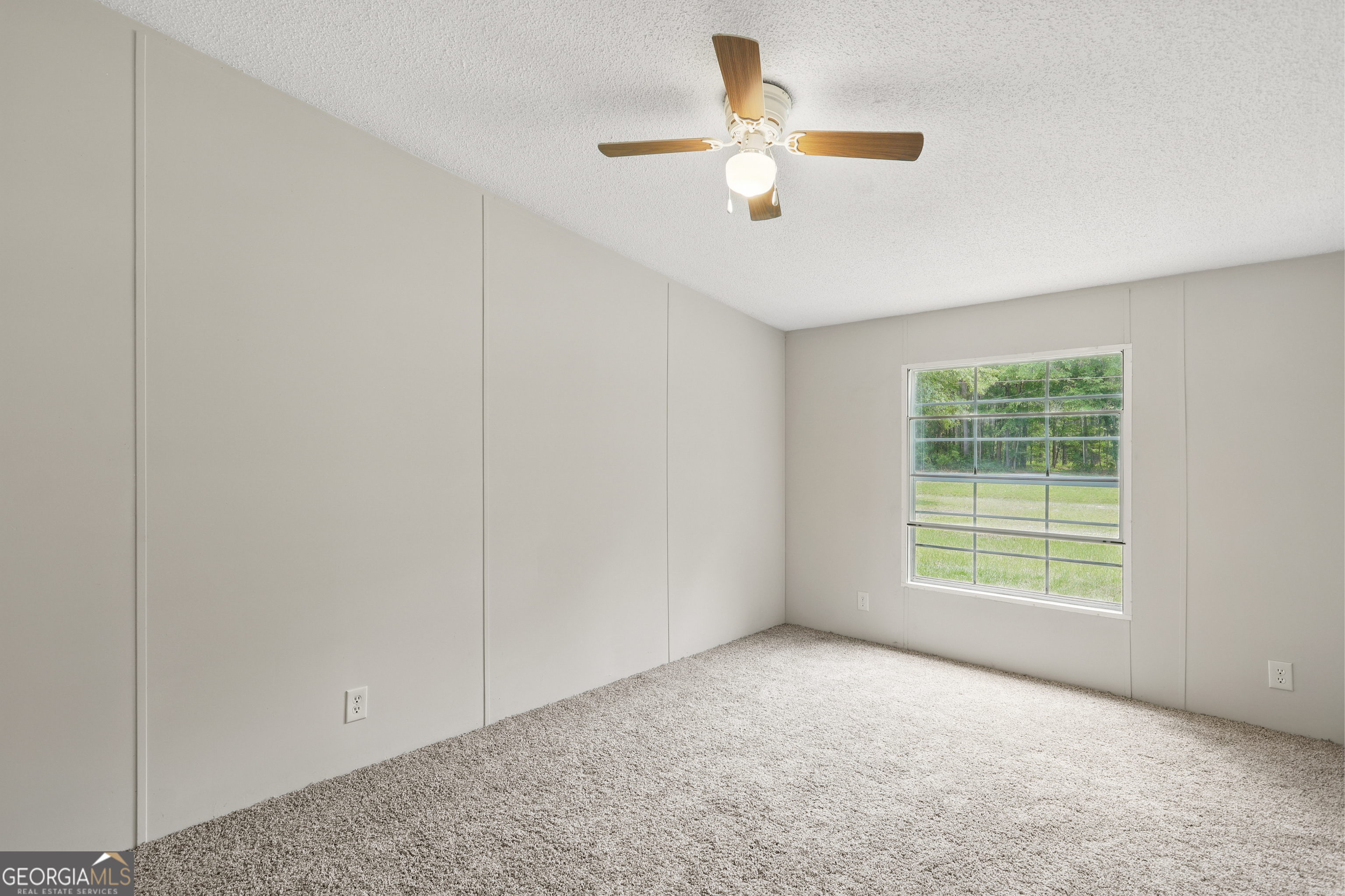 2830 Rincon-Stillwell Road Rincon, GA 31326 - Photo 42 of 52 an empty room with chandelier fan and windows