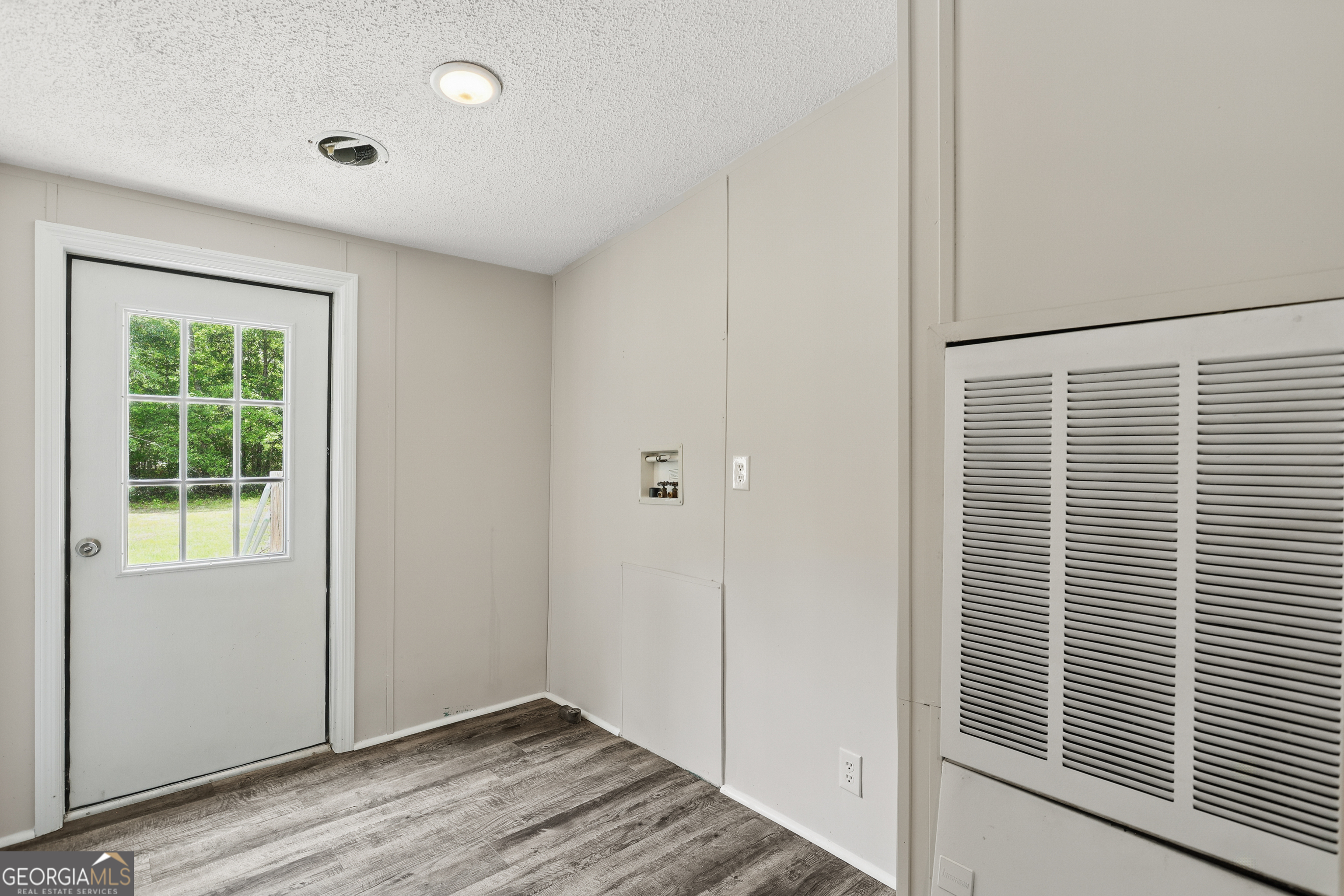 2830 Rincon-Stillwell Road Rincon, GA 31326 - Photo 43 of 52 a view of an empty room with wooden floor and a window