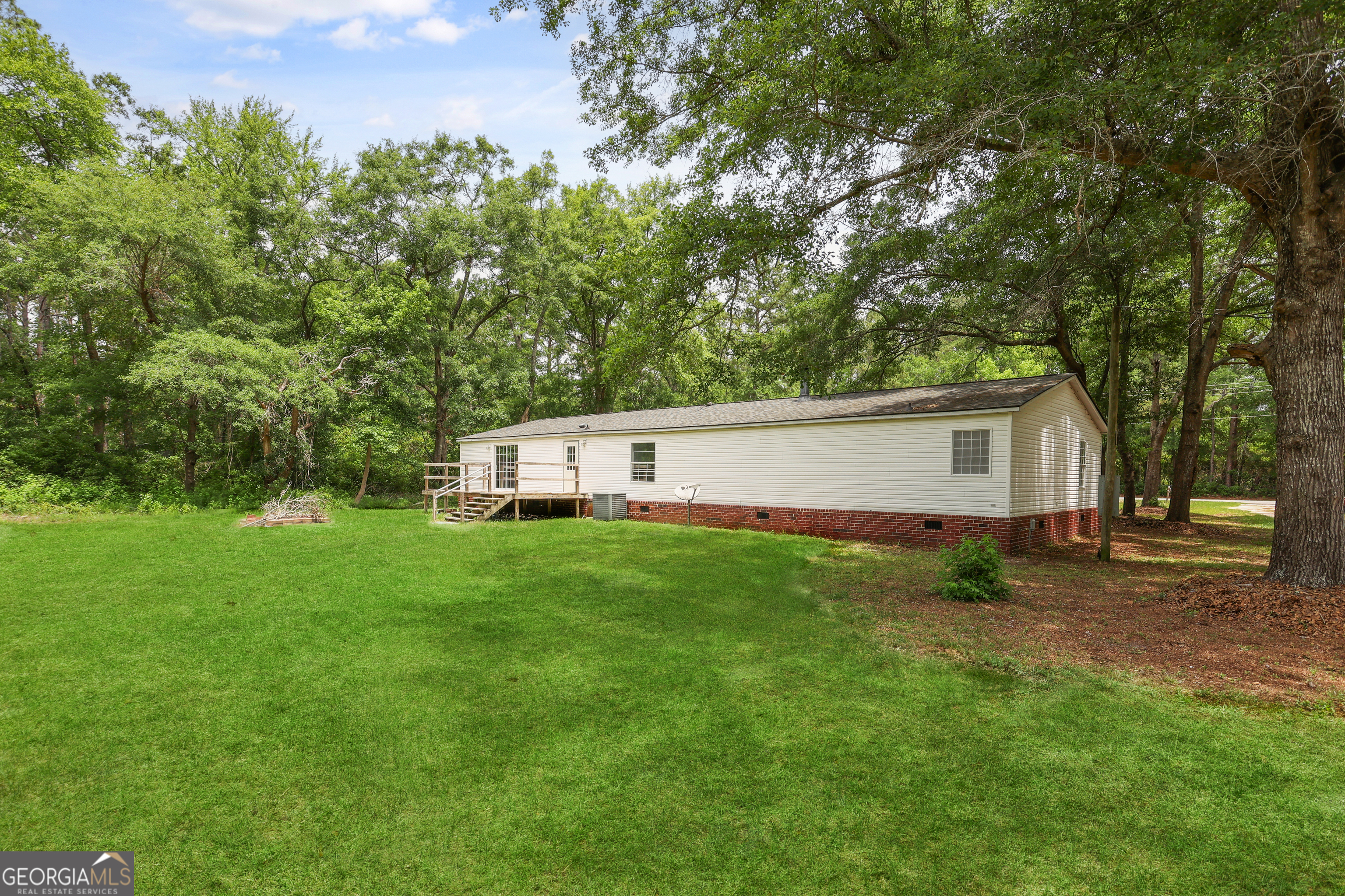 2830 Rincon-Stillwell Road Rincon, GA 31326 - Photo 48 of 52 a view of a backyard with a garden and trees