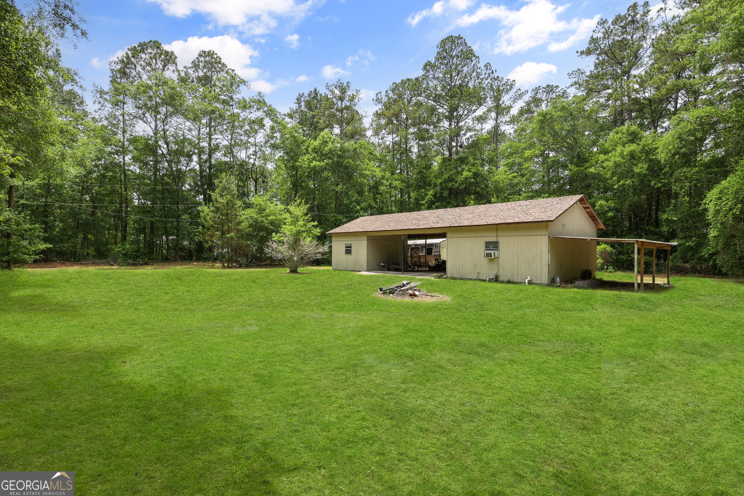 2830 Rincon-Stillwell Road Rincon, GA 31326 - Photo 50 of 52 a front view of house with yard and trees in the background