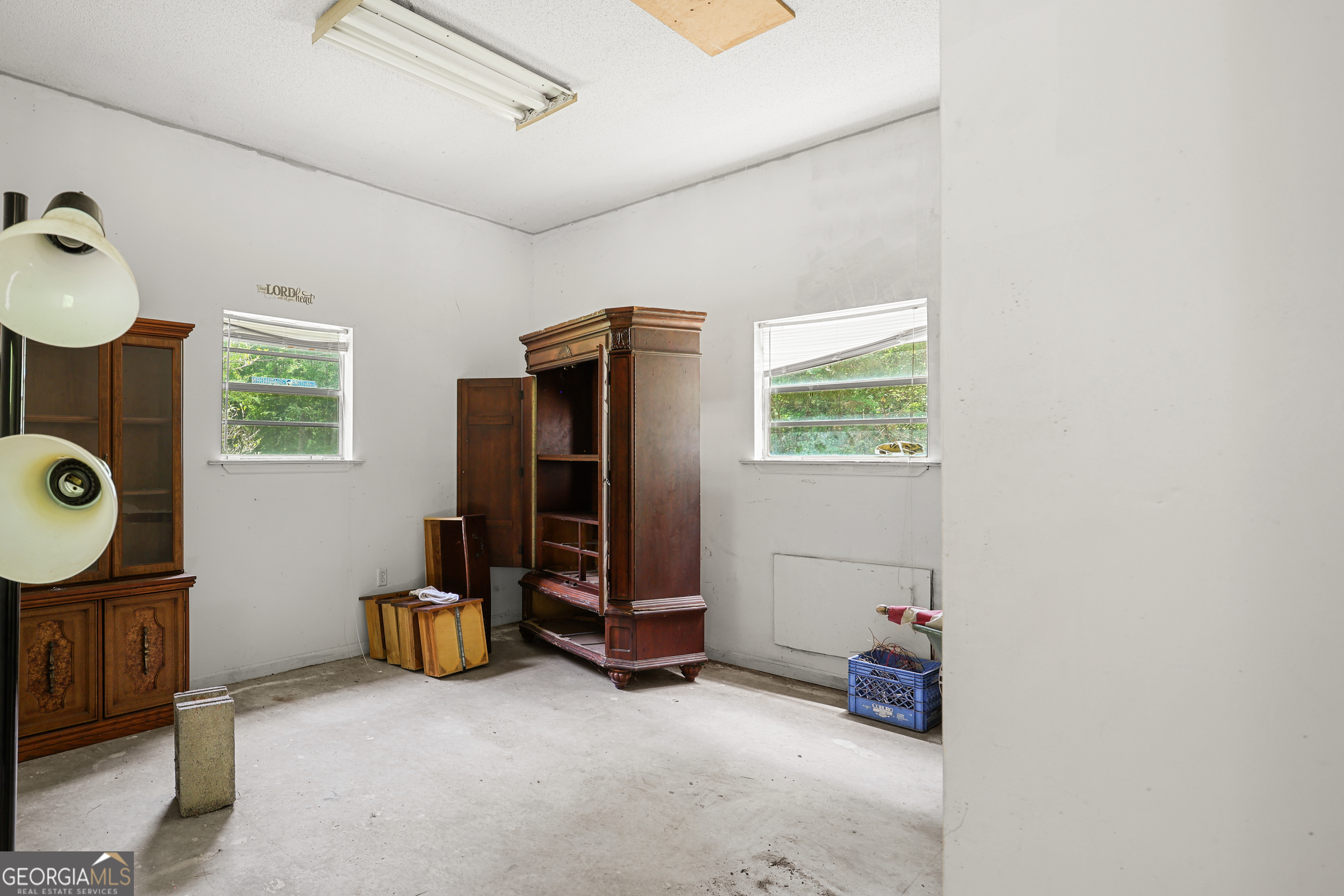 2830 Rincon-Stillwell Road Rincon, GA 31326 - Photo 52 of 52 a view of an empty room with wooden floor and windows