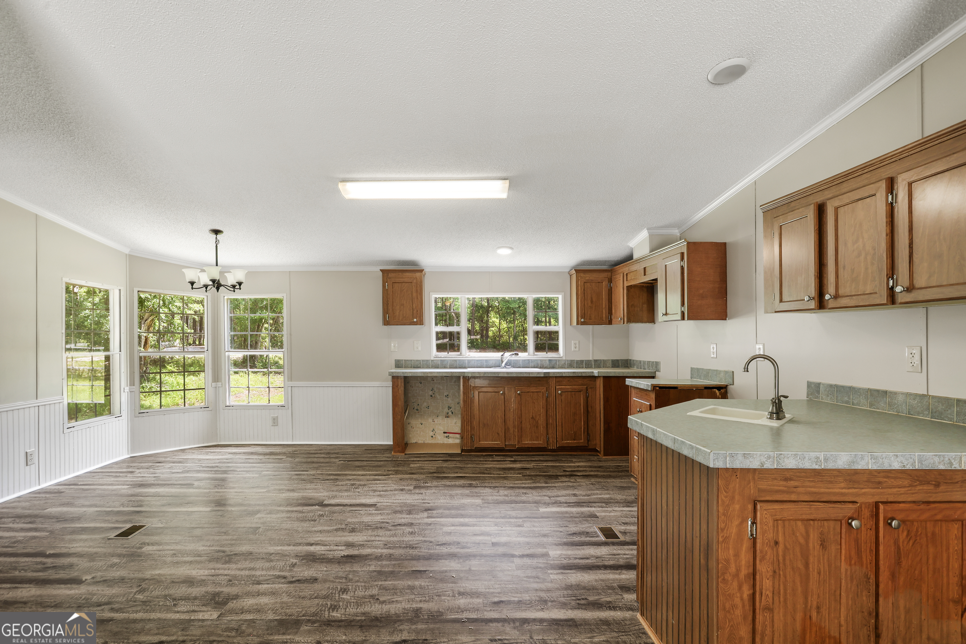 2830 Rincon-Stillwell Road Rincon, GA 31326 - Photo 7 of 52 a kitchen with stainless steel appliances granite countertop a sink a stove and a wooden floors