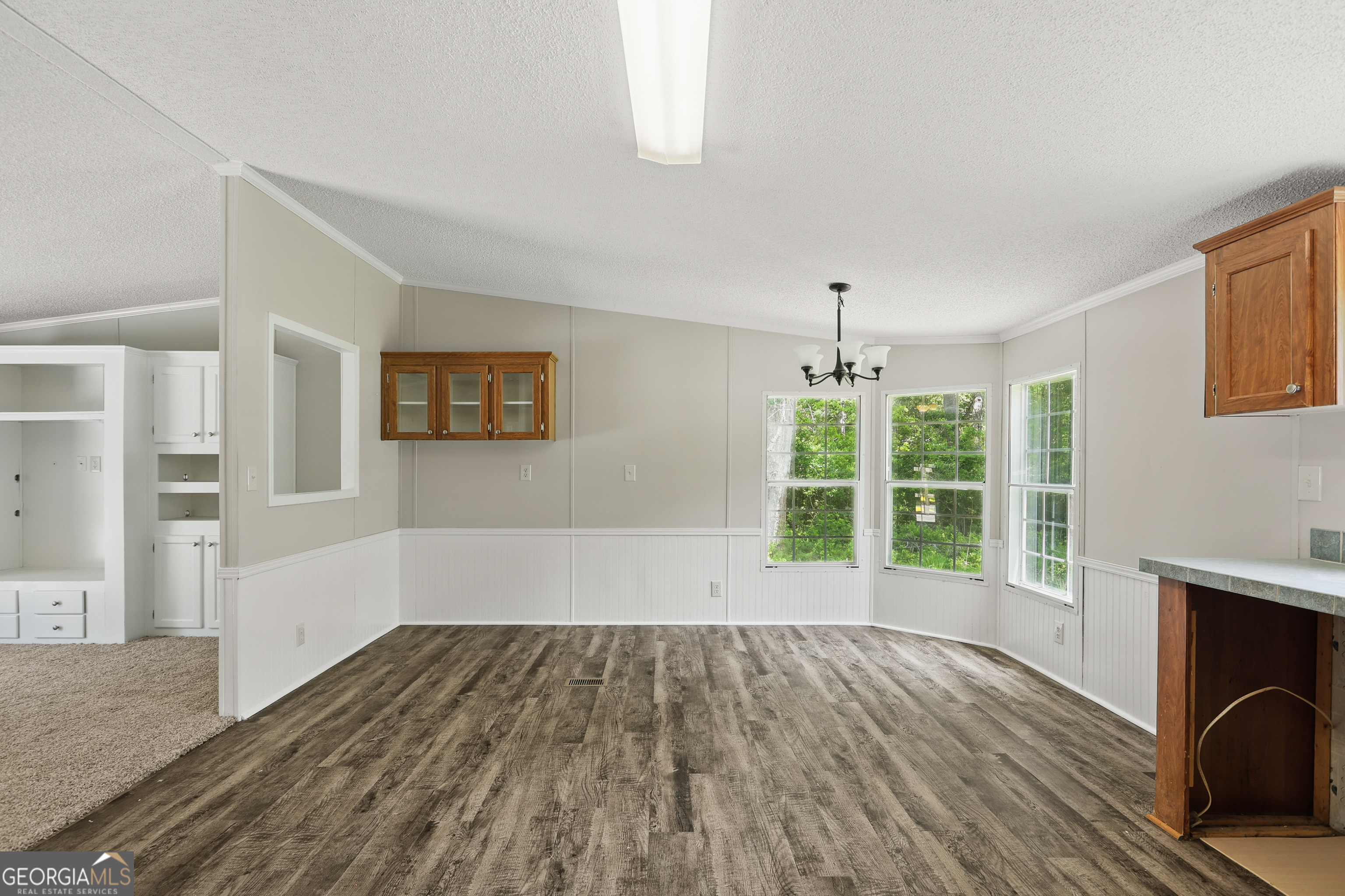 2830 Rincon-Stillwell Road Rincon, GA 31326 - Photo 9 of 52 a view of empty room with wooden floor and fan