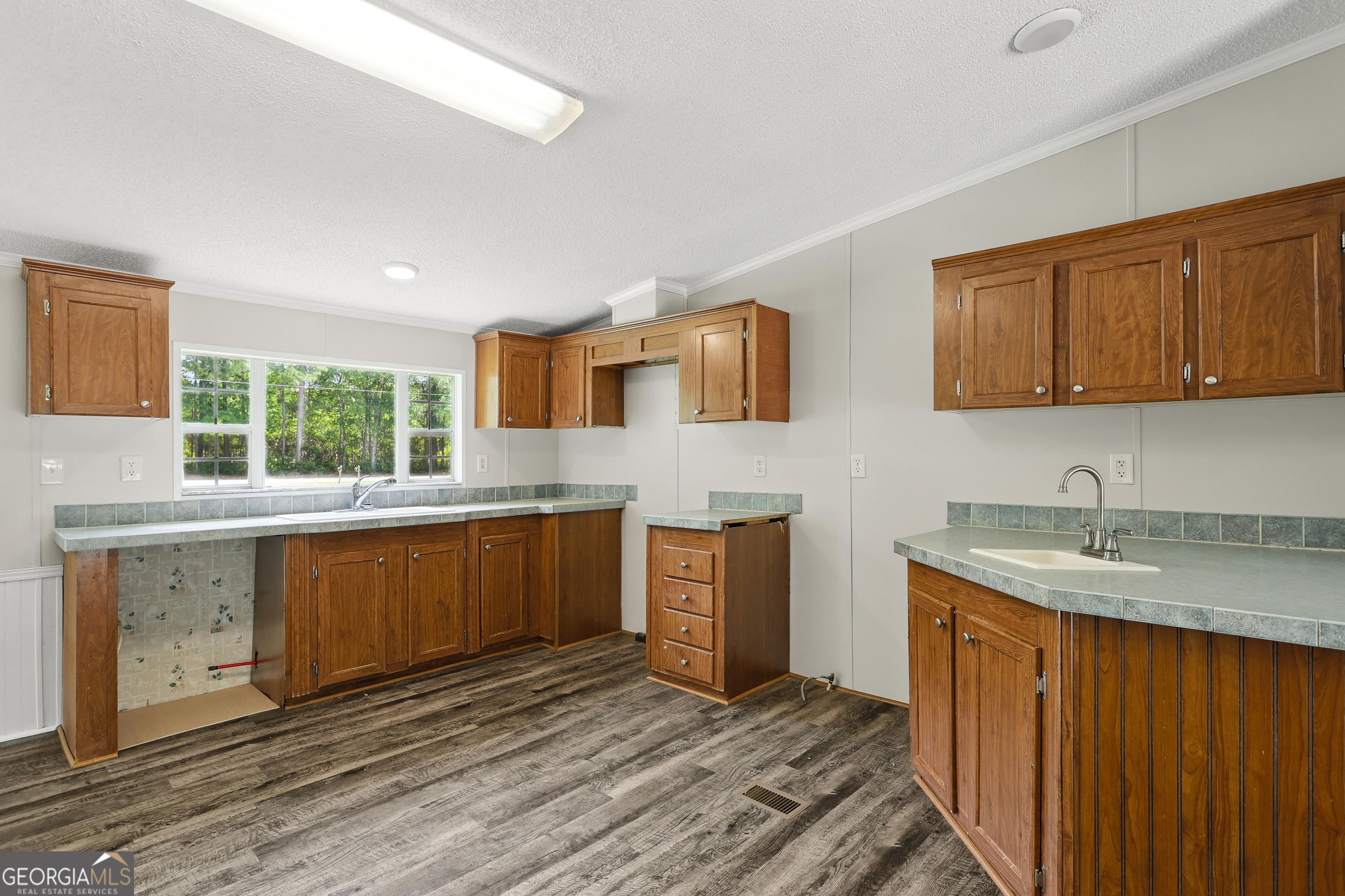 2830 Rincon-Stillwell Road Rincon, GA 31326 - Photo 10 of 52 a kitchen with stainless steel appliances granite countertop a sink stove and cabinets