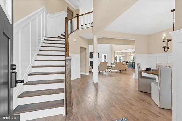 a open kitchen with stainless steel appliances granite countertop a lot of counter space and wooden floors