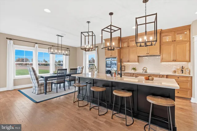 a view of a workspace room with wooden floor