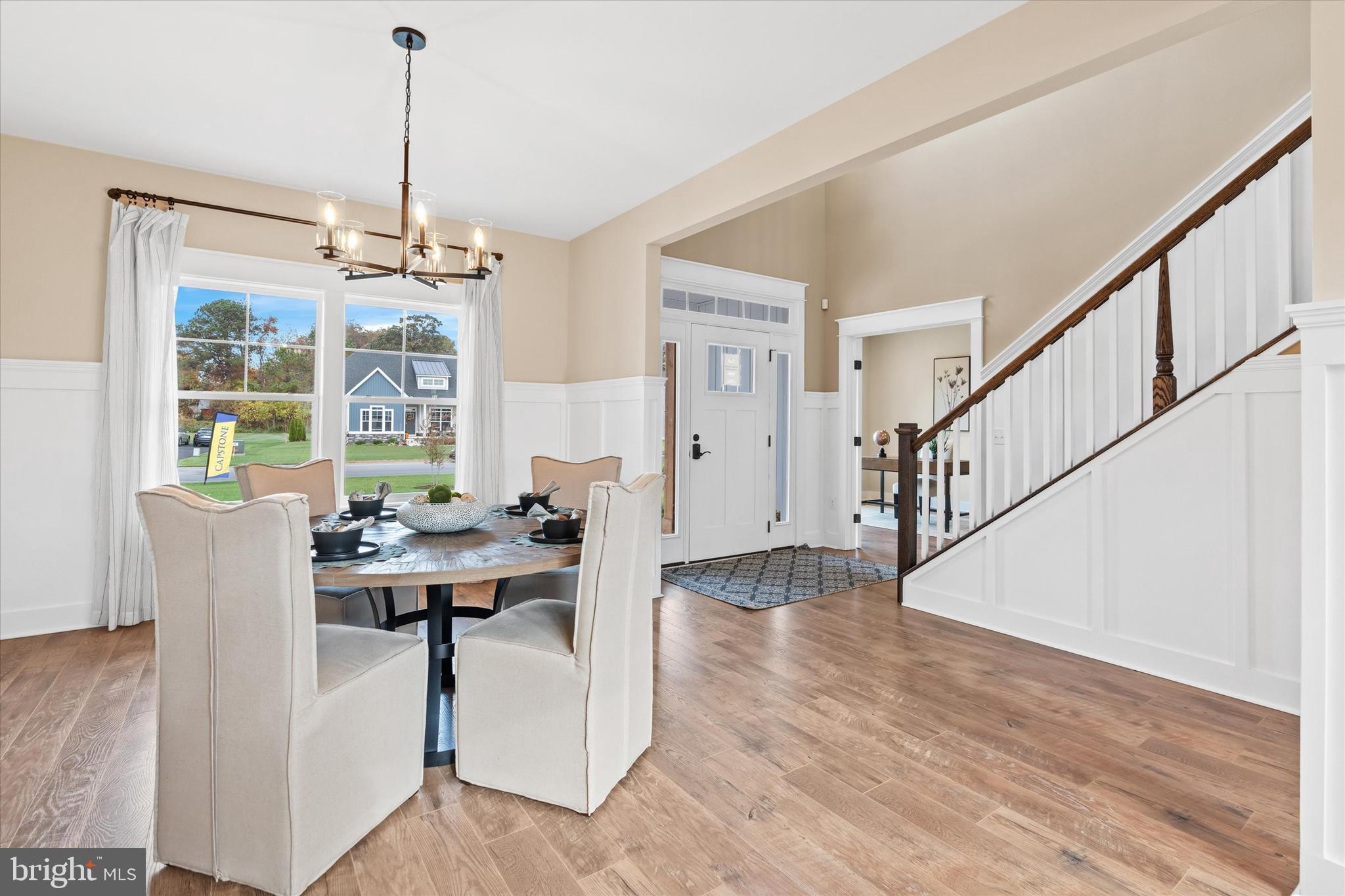 Lot#21 Hummingbird Road Ellendale, DE 19941 - Photo 32 of 65 a view of a dining room with furniture window and wooden floor