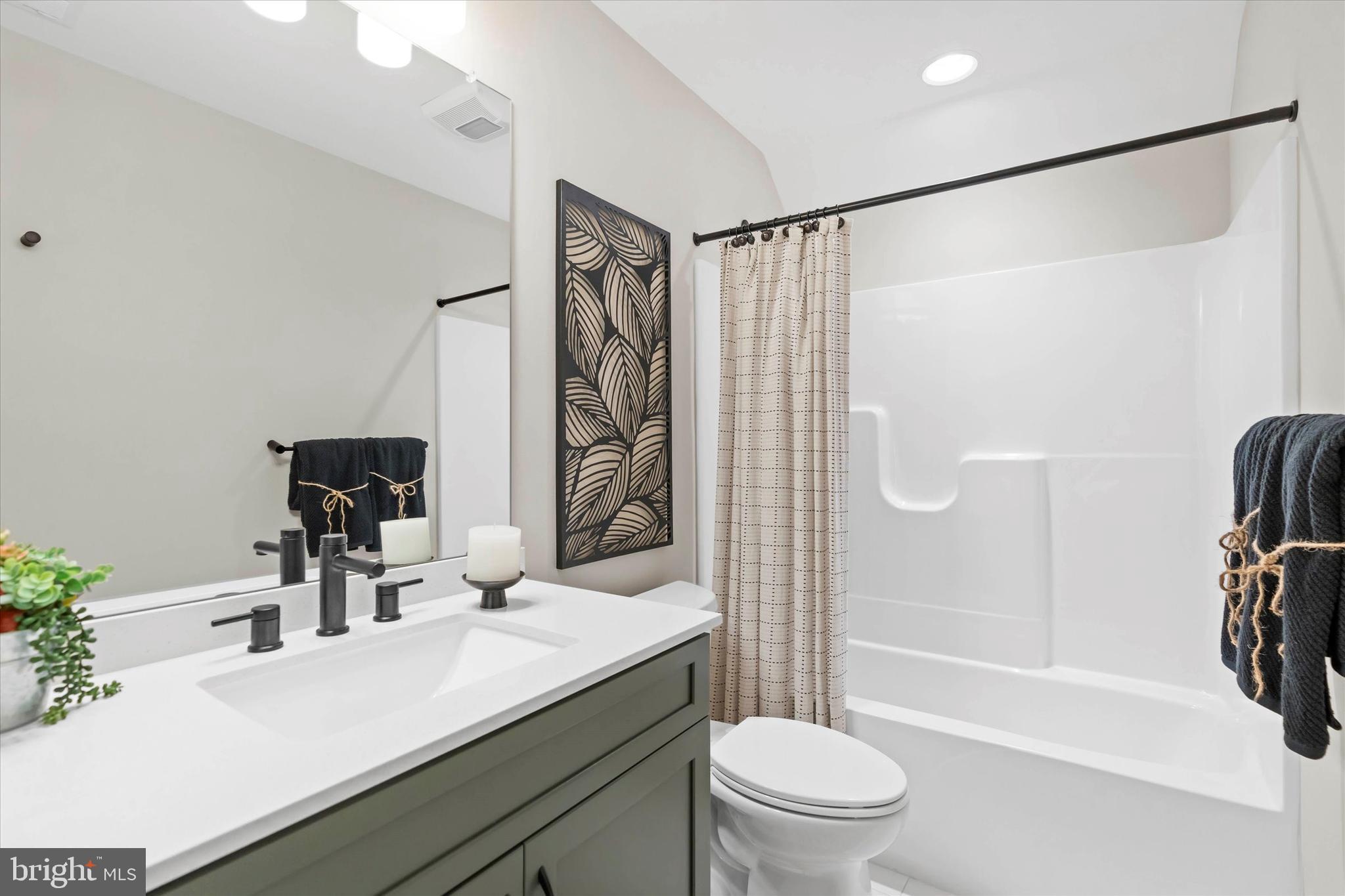 Lot#21 Hummingbird Road Ellendale, DE 19941 - Photo 40 of 66 a bathroom with a sink a toilet and shower