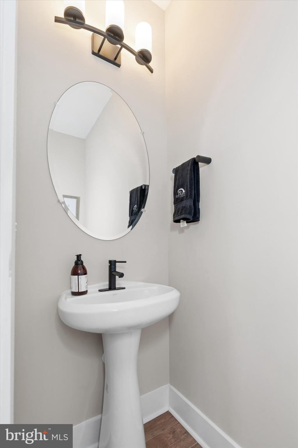 Lot#21 Hummingbird Road Ellendale, DE 19941 - Photo 50 of 66 a bathroom with a sink a mirror and vanity