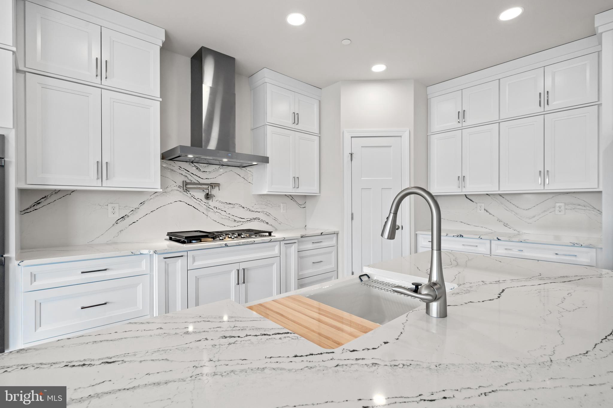 Lot#21 Hummingbird Road Ellendale, DE 19941 - Photo 7 of 66 a kitchen with granite countertop a stove a sink and a microwave