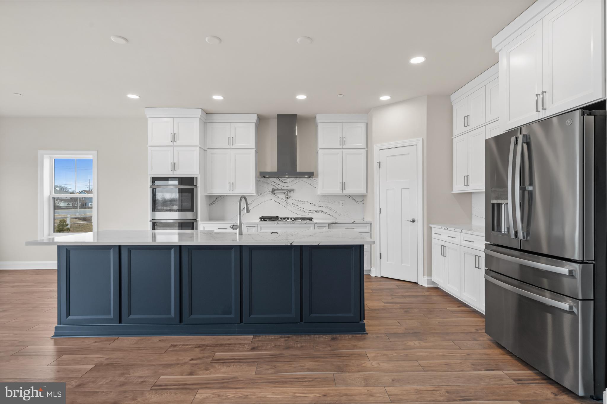 Lot#21 Hummingbird Road Ellendale, DE 19941 - Photo 9 of 66 a kitchen with stainless steel appliances granite countertop a refrigerator and a sink