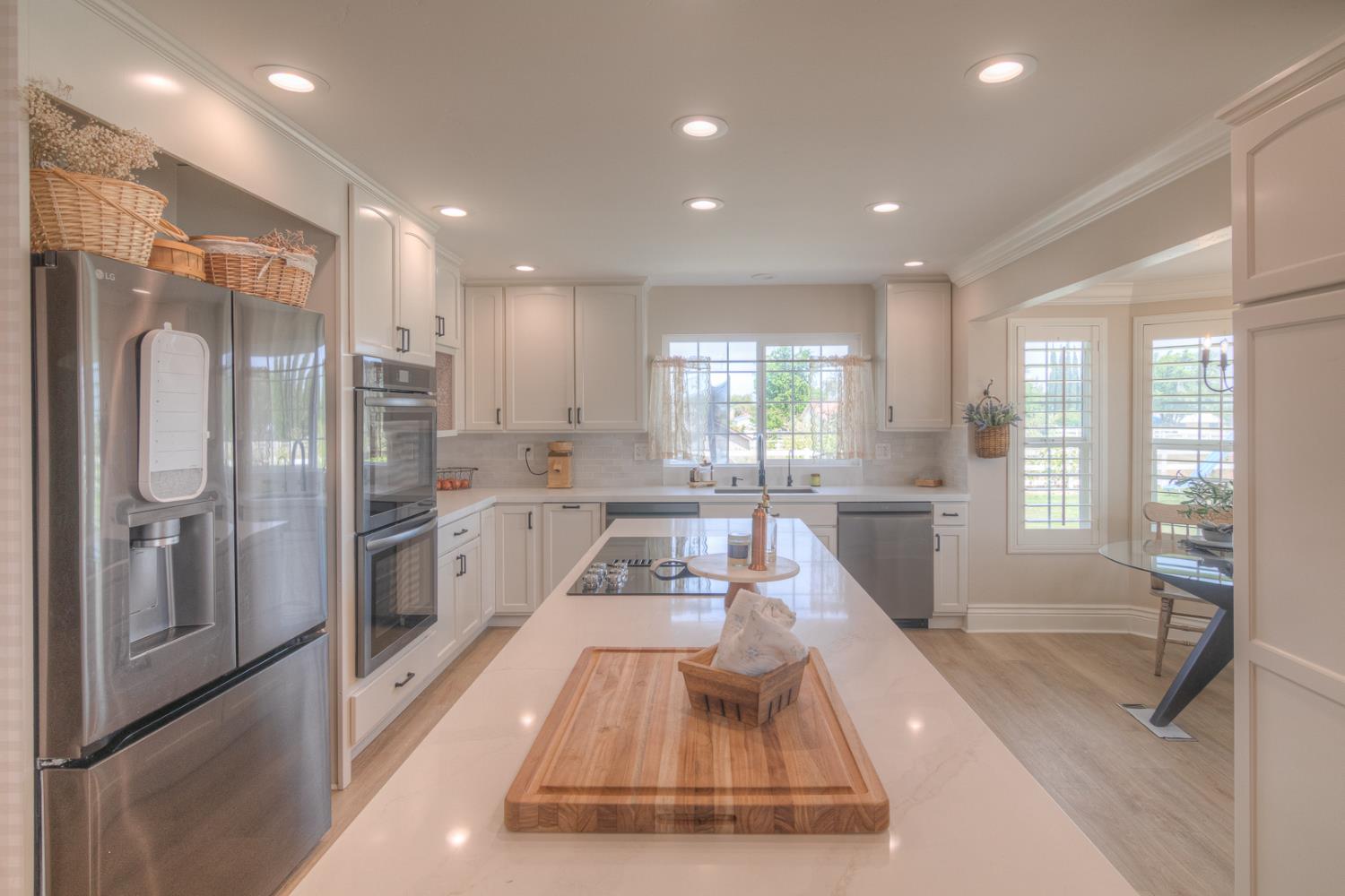 34672 Bernard Road Tracy, CA 95377 - Photo 15 of 80 a large white kitchen with large windows