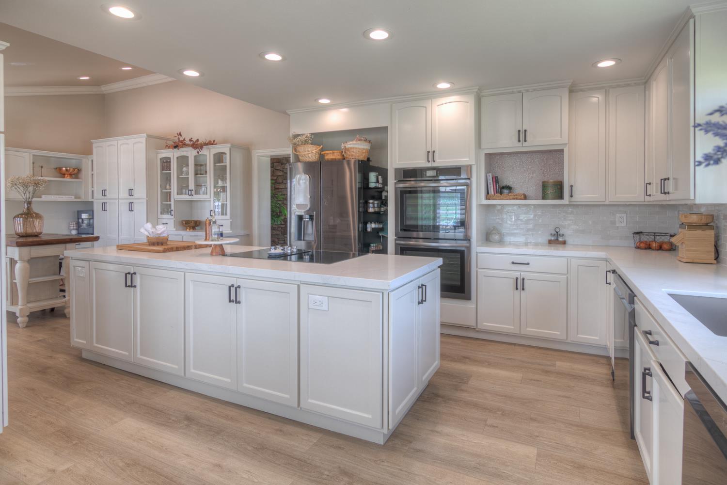 34672 Bernard Road Tracy, CA 95377 - Photo 17 of 80 a kitchen with a sink window and cabinets