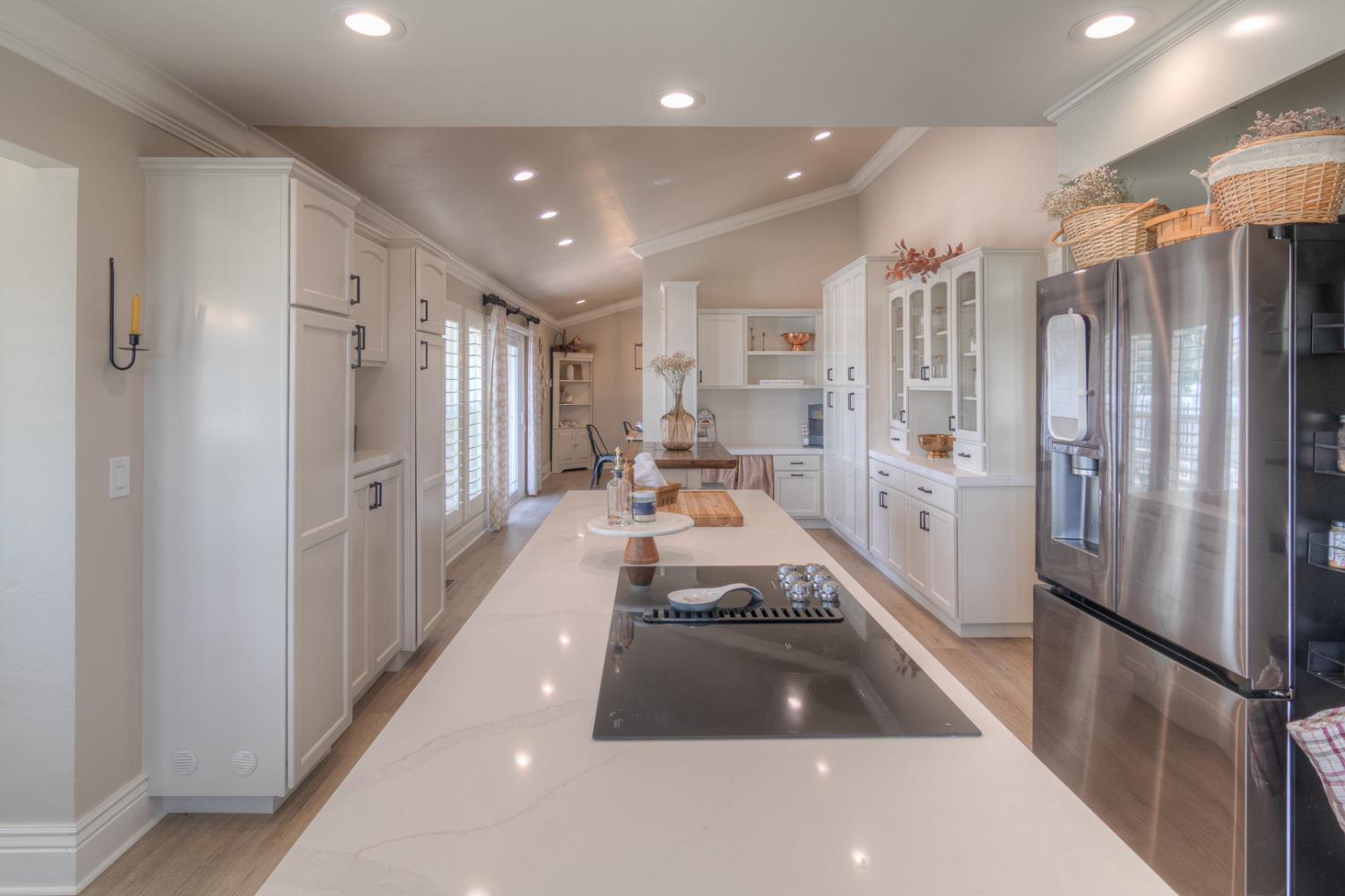 34672 Bernard Road Tracy, CA 95377 - Photo 20 of 80 a large white kitchen with lots of appliances and cabinets