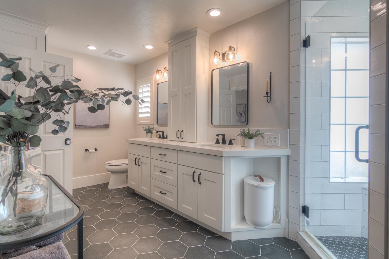 34672 Bernard Road Tracy, CA 95377 - Photo 39 of 80 a bathroom with a double vanity sink mirror and toilet