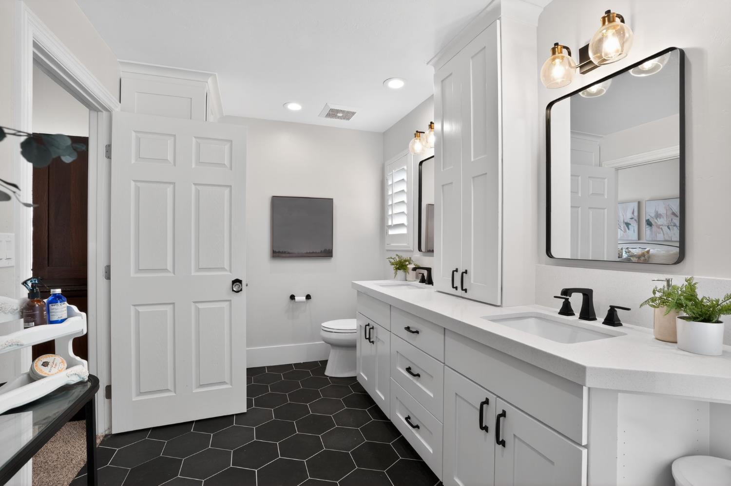 34672 Bernard Road Tracy, CA 95377 - Photo 40 of 80 a spacious bathroom with a double vanity sink mirror and toilet