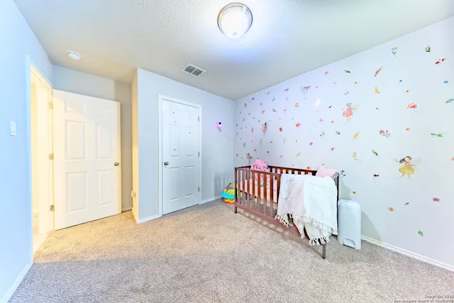 a view of a livingroom with entryway and stairs