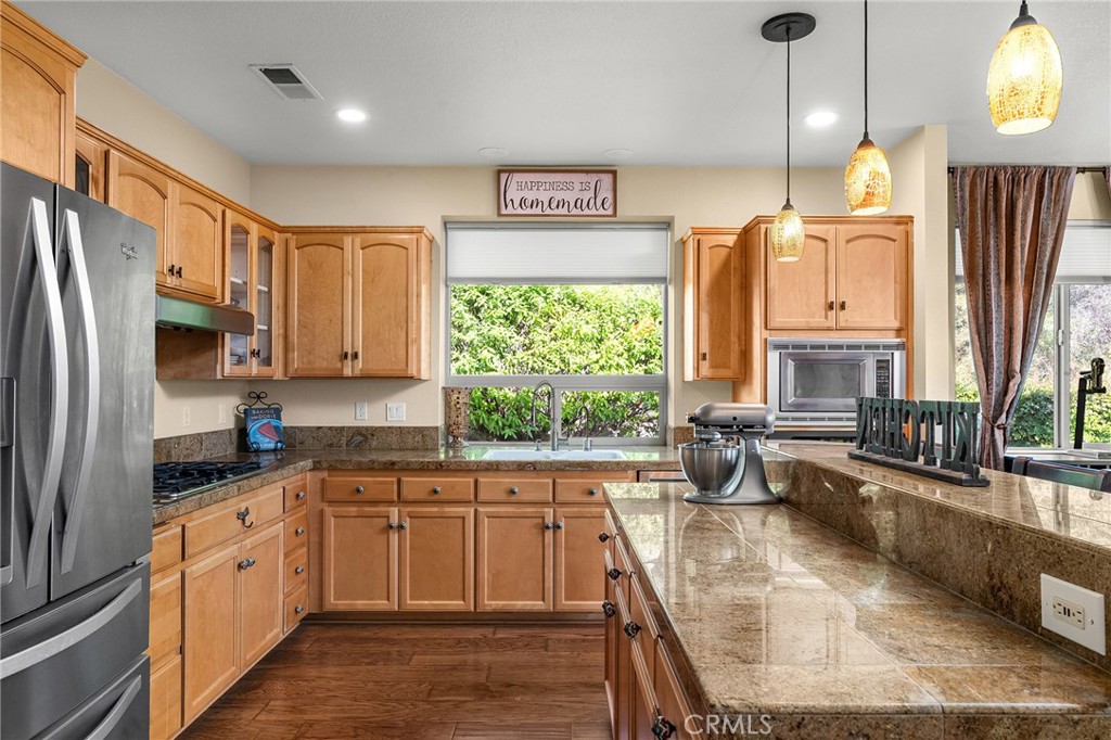 3560 Shadowtree Lane Chico, CA 95928 - Photo 11 of 52 a kitchen with stainless steel appliances granite countertop a sink stove and refrigerator