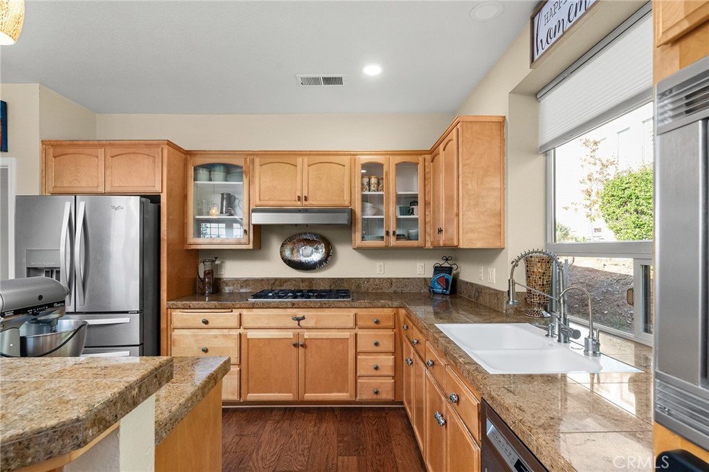 3560 Shadowtree Lane Chico, CA 95928 - Photo 12 of 52 a kitchen with a stove a sink and a refrigerator